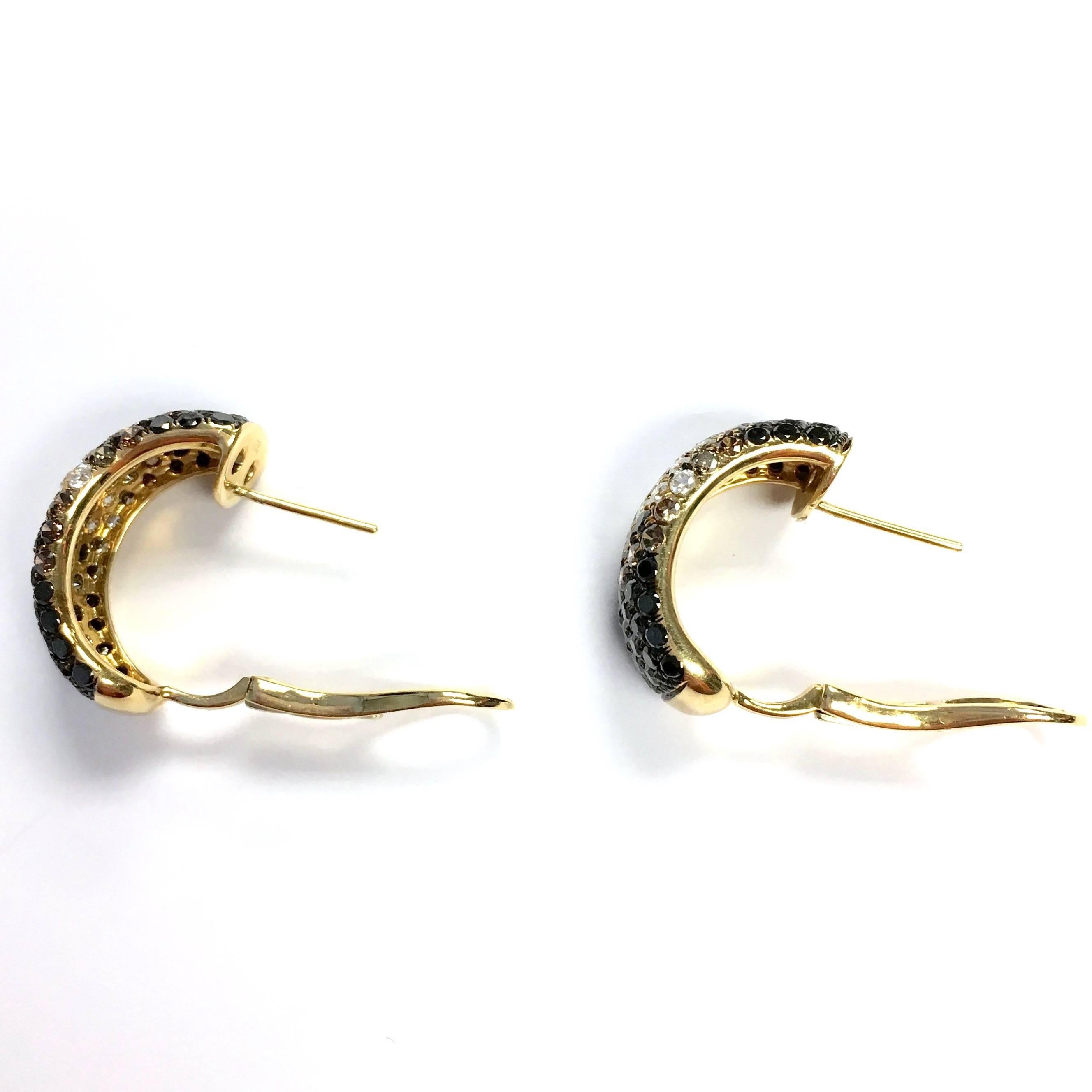 18K yellow gold 12 mm wide J-hoop earrings, pave set with 5.30 carats of high quality white, champagne, brown and black diamonds. The white diamonds are VS clarity, F-G color.  Post and omega backs.
Measurements: 23 mm L x 12 mm W
Weight: 11.7 grams