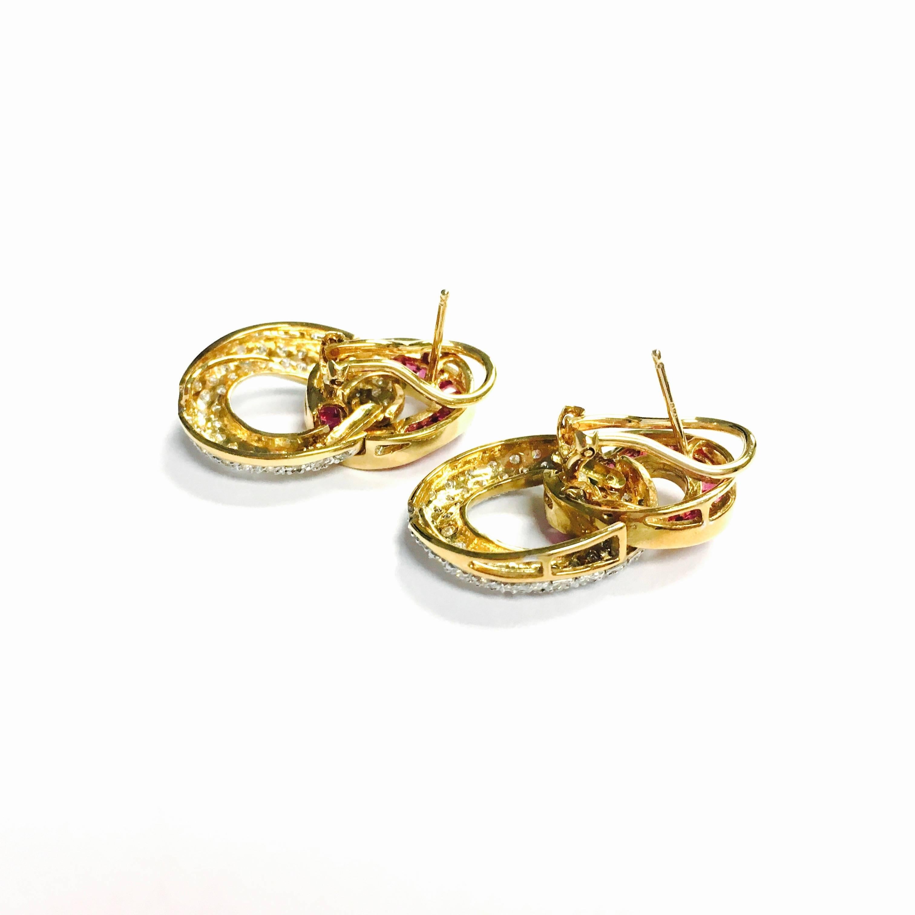 Vintage 18K yellow gold earrings with post and omega backs. Each earring features a 7/8