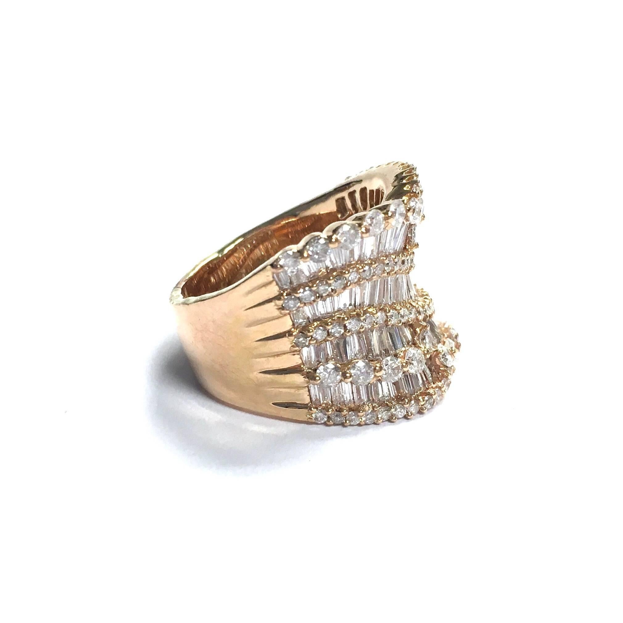 Gorgeous 18K rose gold ballerina style diamond ring. Featuring a concave design on the front set with curved ribbons of baguette and round brilliant cut diamonds. 
Approximate total diamond weight: 4.5 ct, Color: F-G Clarity: SI
18 mm  (11/16")