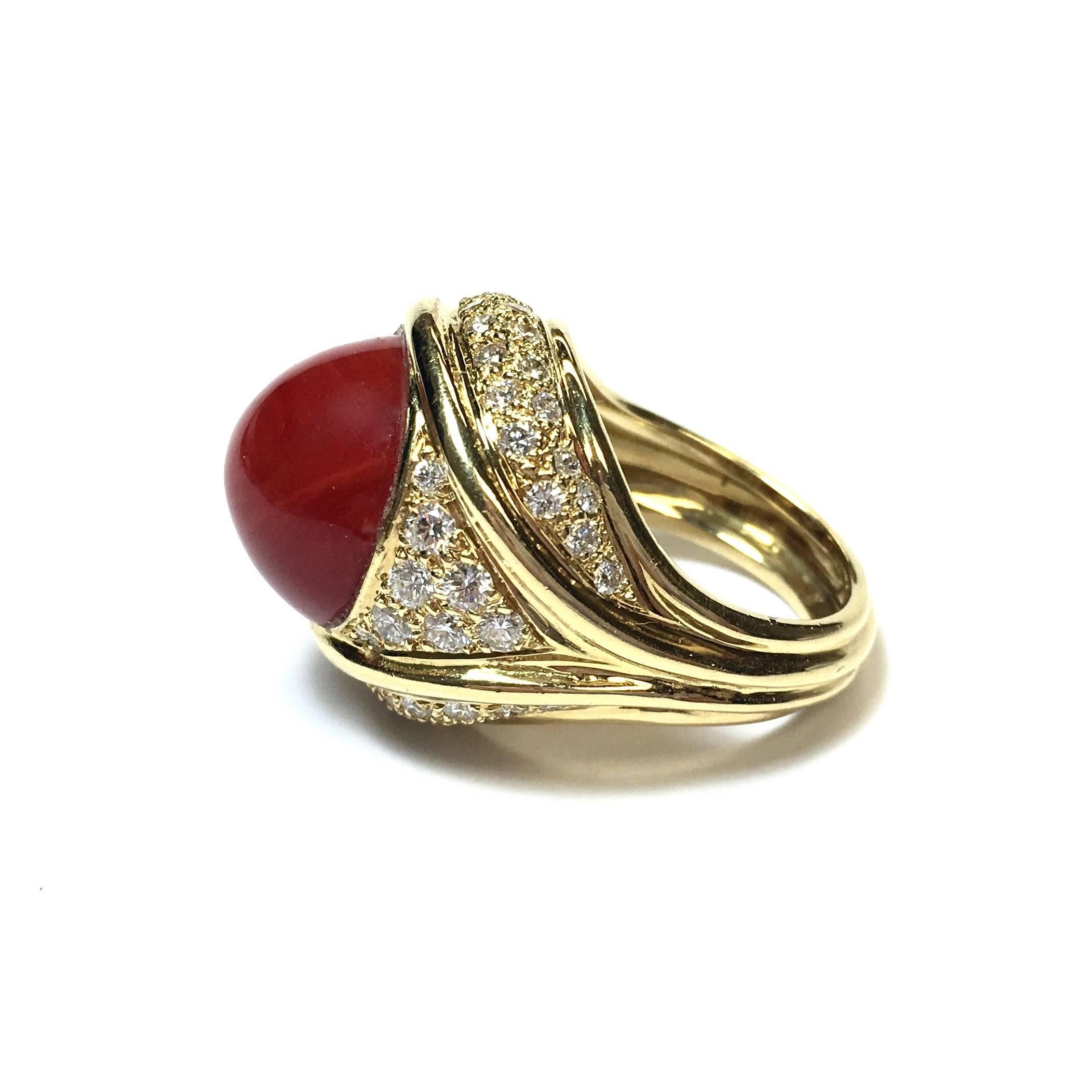 Crafted from 18K yellow gold, featuring a 15 mm coral on the from, set within a gallery of diamonds, supported by a 5 mm wide band.
Approximate total diamond weight: 2.25 carats, Color: F-G, Clarity: VS
Size: 7.5 (Sizable)
Weight: 21.5 grams