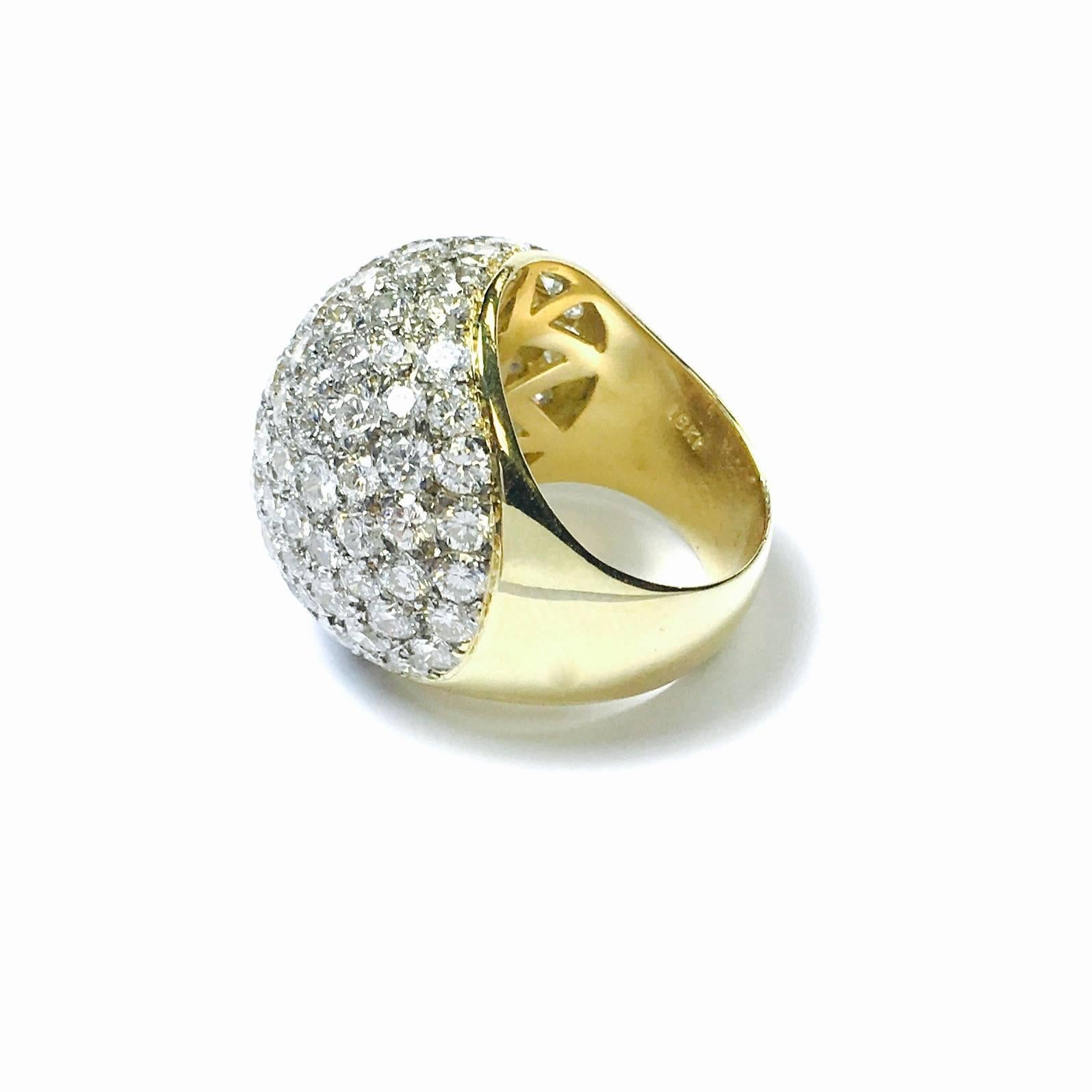 18K yellow and white gold dome ring set with 9 carats of excellent quality diamonds. Color: F-G, Clarity: VS
The front measures 7/8