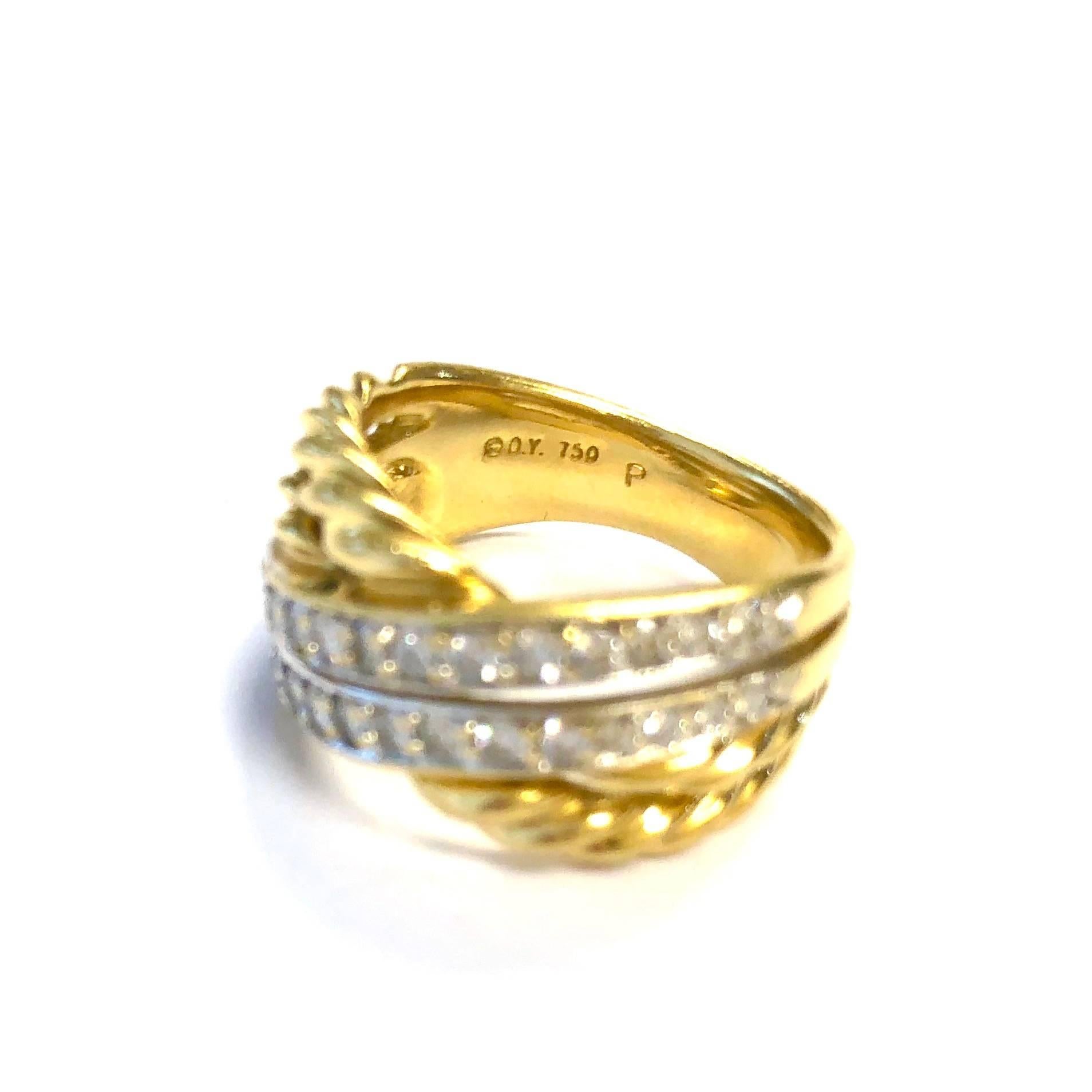 Elegant David Yurman diamond ring crafted in 18K yellow gold. The band displays a rope inspired crossover design set with 30 round brilliant cut diamonds, approximate total weight of 0.75ct, Color: G-H, Clarity: VS1-VS2.
This refined ring also
