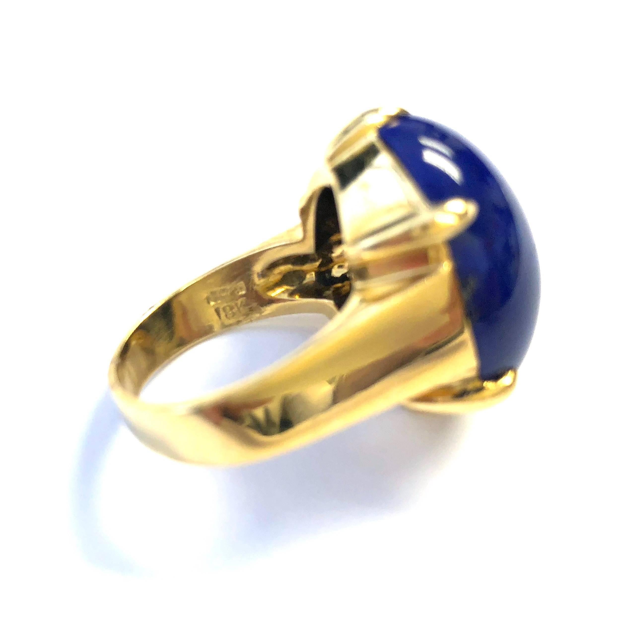 Gump's  San Francisco vintage 18K yellow gold lapis lazuli cabochon ring. Featuring a 25 mm x 19 mm (approx. 18.3 carat) oval cabochon lapis is six-claw set in the center of the ring. Smoothly finished, and designed for comfort. 
Size: 8.25