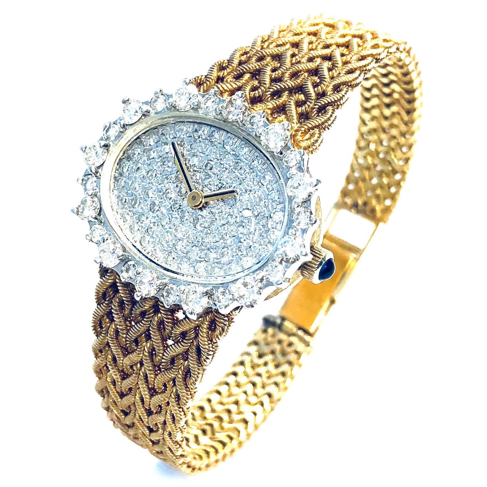 Crafted in 18K gold, the watch features a fully paved diamond dial and diamond bezel, supported by six straps of gold ropes terminating in a fold-over clasp. 
Approximate total diamond weight: 3.00ct, Color: G-H, Clarity: VS
The case including