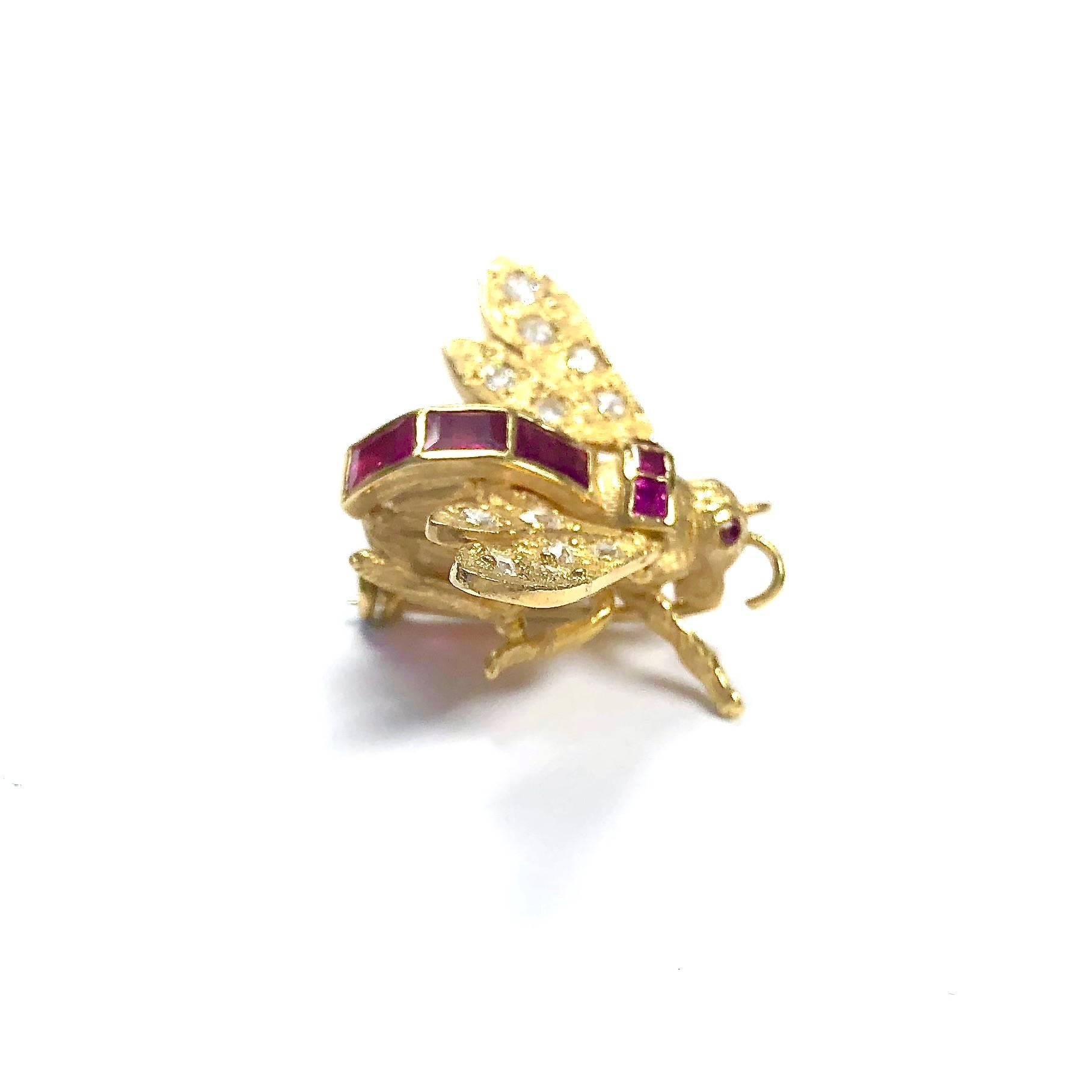 Crafted in 18K yellow gold, set with eight round and rectangular cut vibrant red rubies and twelve old mine and old european cut diamonds. 
Approximate total ruby weight: 3.00ct
Approximate total diamond weight: 0.70ct. Color: H-I Clarity: