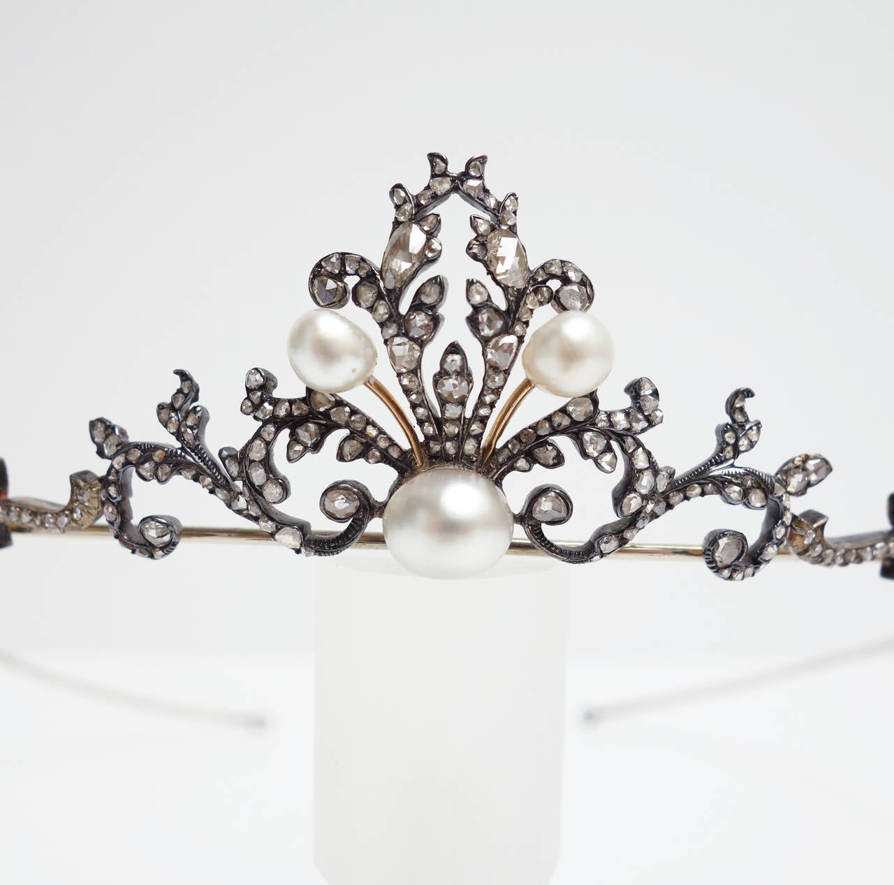 If you are dreaming about a fairy tale wedding, this would be the perfect tiara for you. Absolutely gorgeous, and it is in excellent condition. 
From the Victorian era, featuring 3 natural pearl set in a scroll design of rose cut diamond set