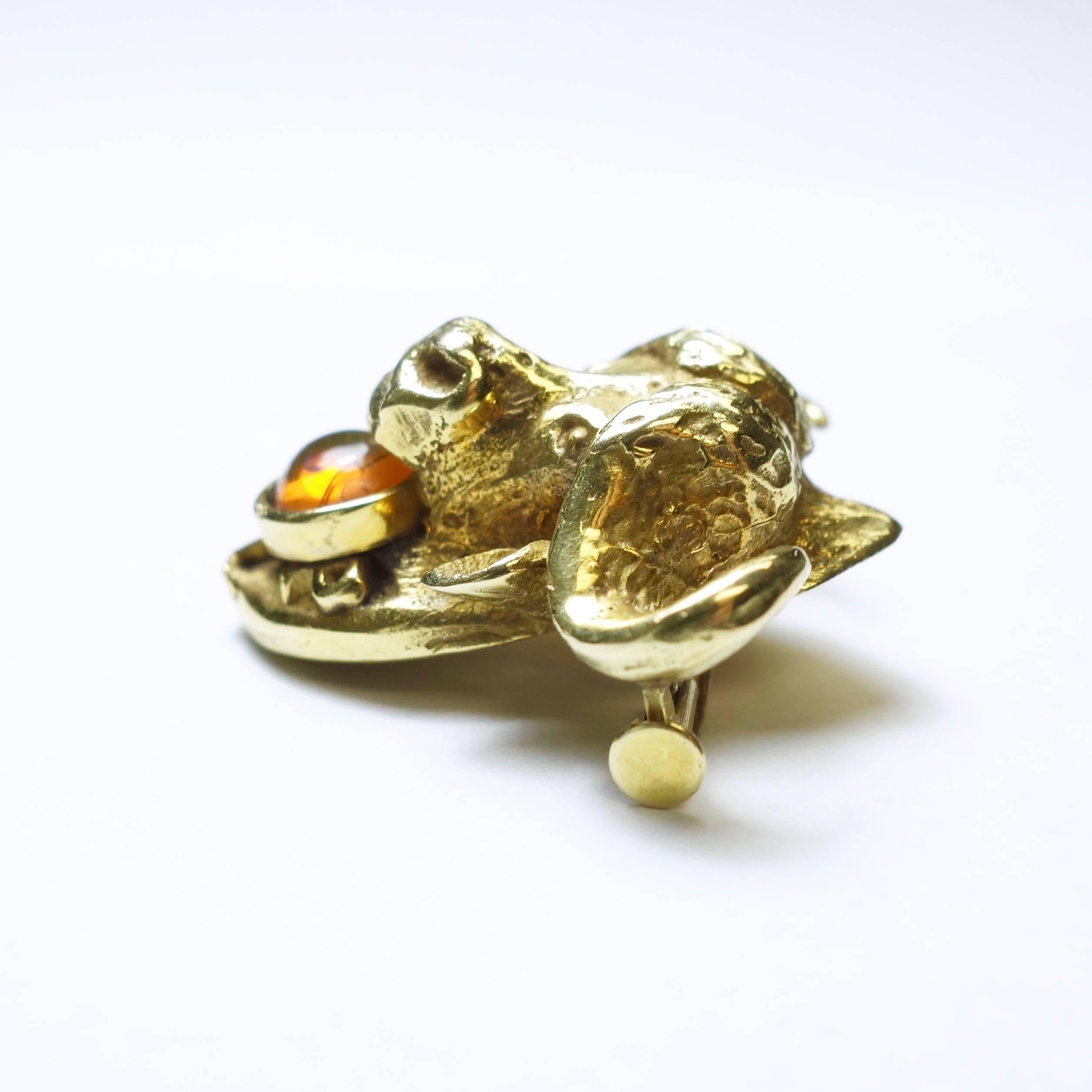 Crafted in 18K yellow gold the brooch features a water buffalo's head accented with a round cabochon crystal opal and J L P initials. The opal has some fractures but not chipped. 
Measurements: W 22.6mm x H 25.5 mm
Weight: 10.4 grams