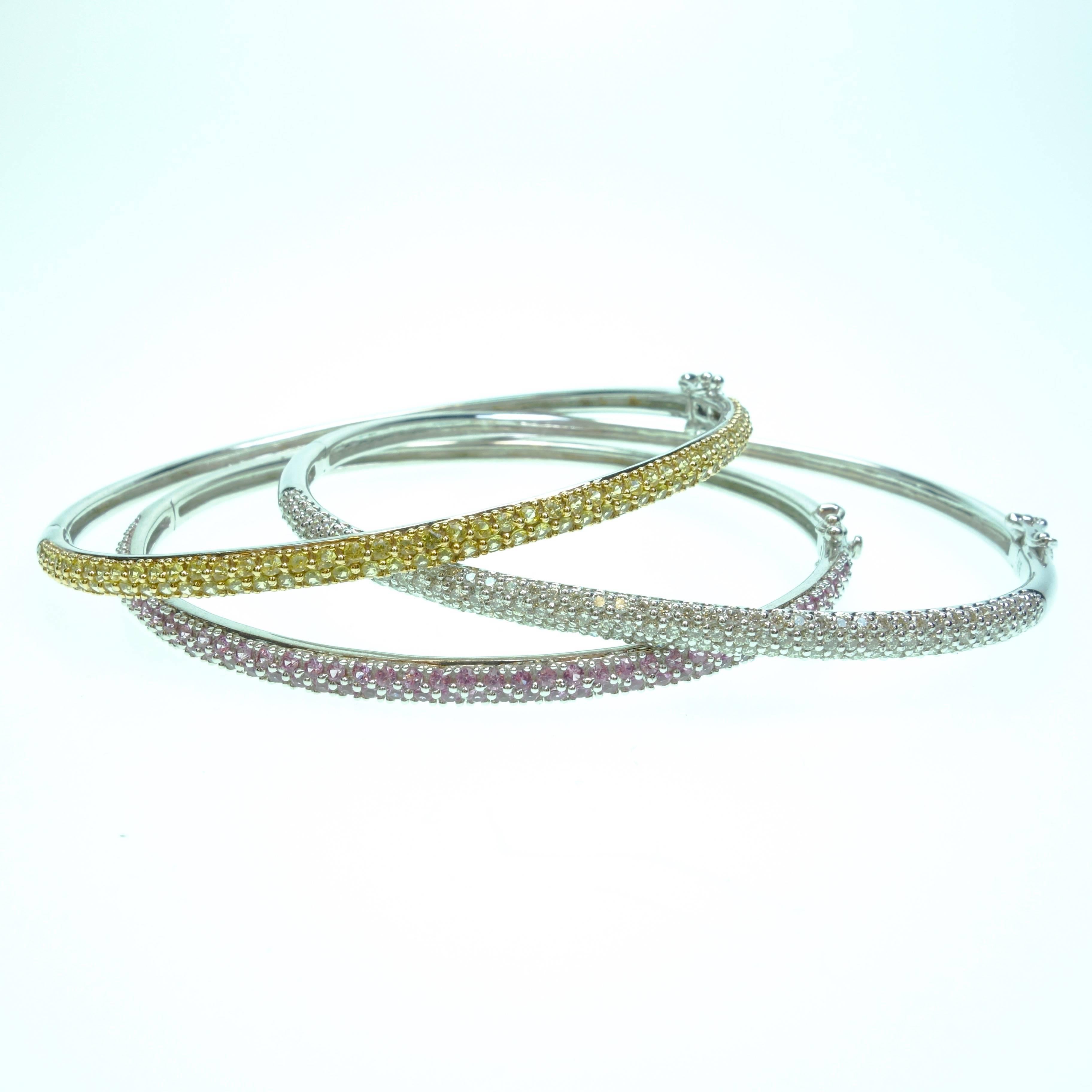 Set of 3 14K white gold pave's set hinged bangle bracelets. 
-One bracelet is set with 96 round cut yellow sapphires, approximate total weight of 1.80ct (6.5