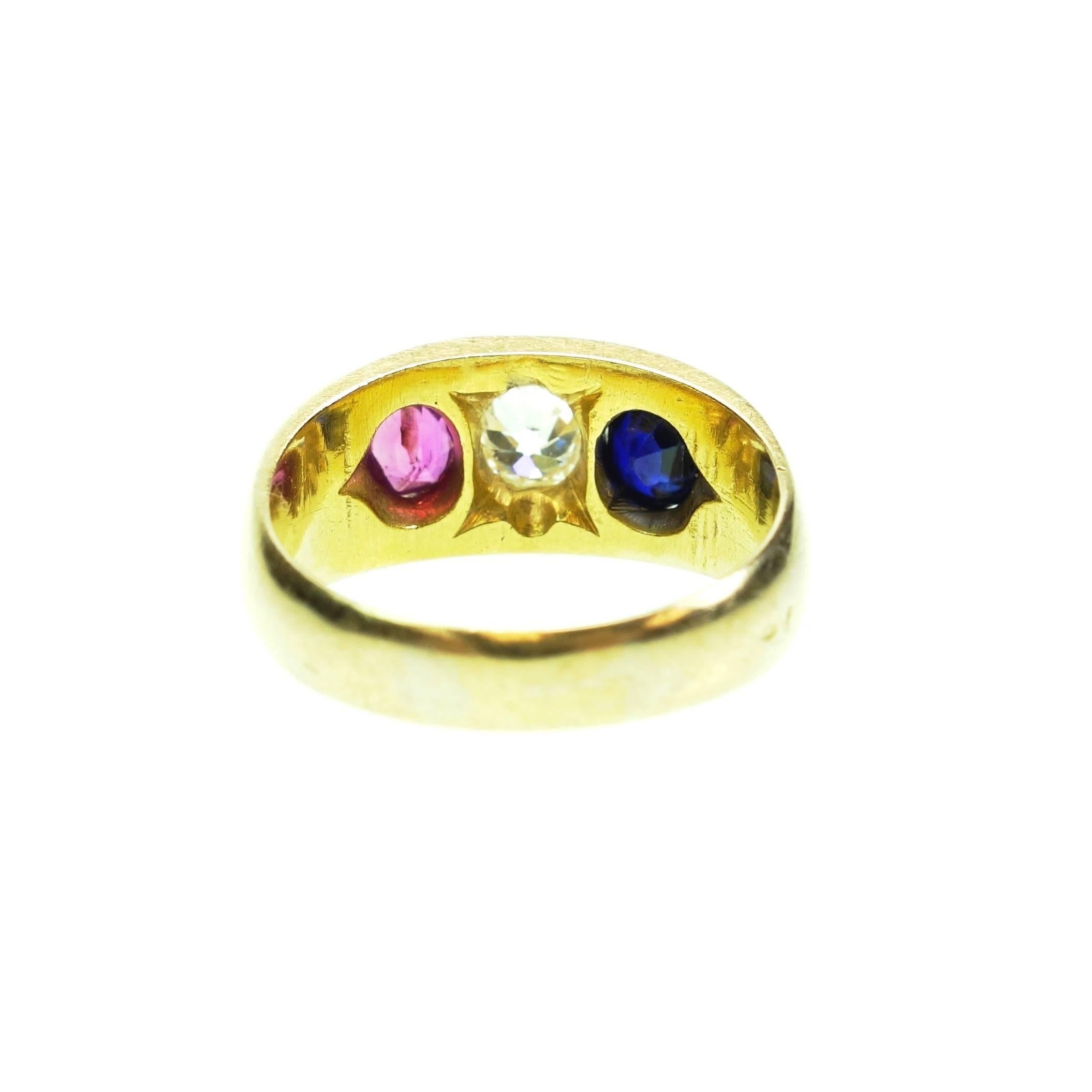 Crafted in 18K yellow gold and kept in it's original condition this beautiful 
three-stone ring. In the center there is an approximately 0.50ct old european cut diamond, Color: H, Clarity: VS-1
Next to the diamond is a lively natural ruby and a