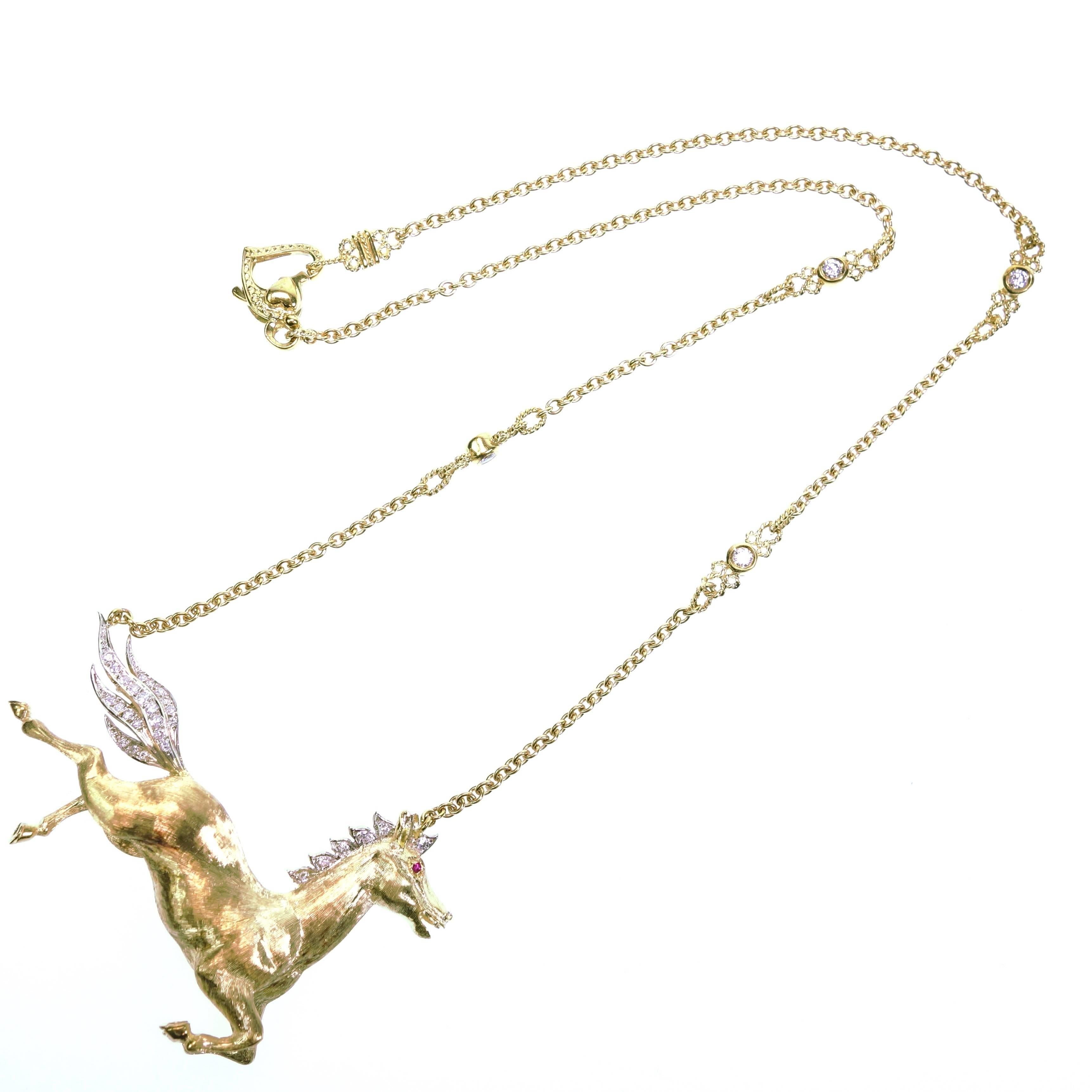 Vintage Laykin et Cie 18kt yellow gold horse with a white gold diamond set tail and ruby eye, supported by a stylized 18K yellow gold diamonds by the yard chain. The horse was originally a brooch and it is converted into a necklace. Finished with a