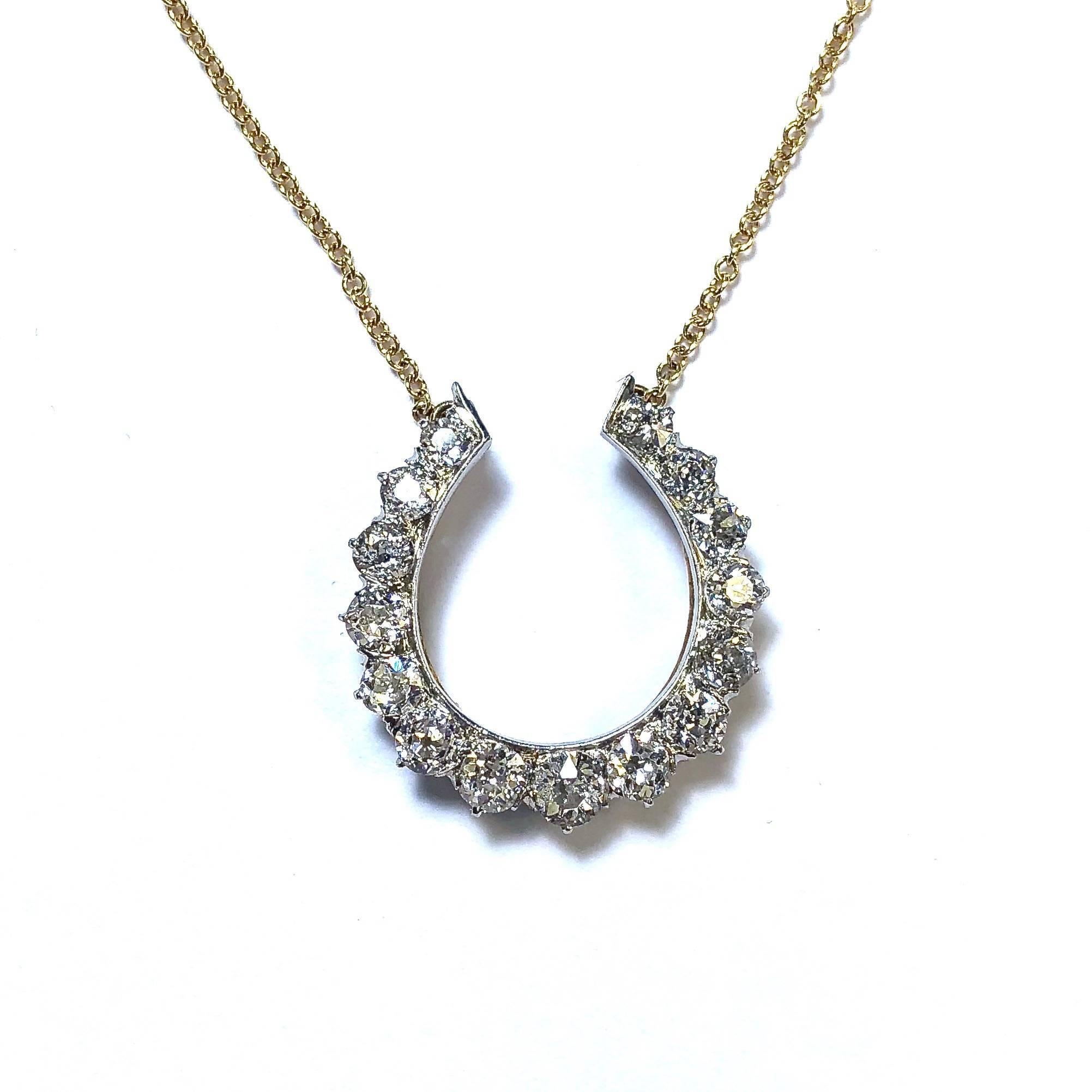 Gorgeous graduating diamond horse shoe necklace crafted in yellow and white gold, set with 15 old european cut diamonds measuring from 2.50 mm up to 3.50 mm in diameter. Approximate total diamond weight: 2.00ct. Color: H-I Clarity: VS2-SI2
The horse