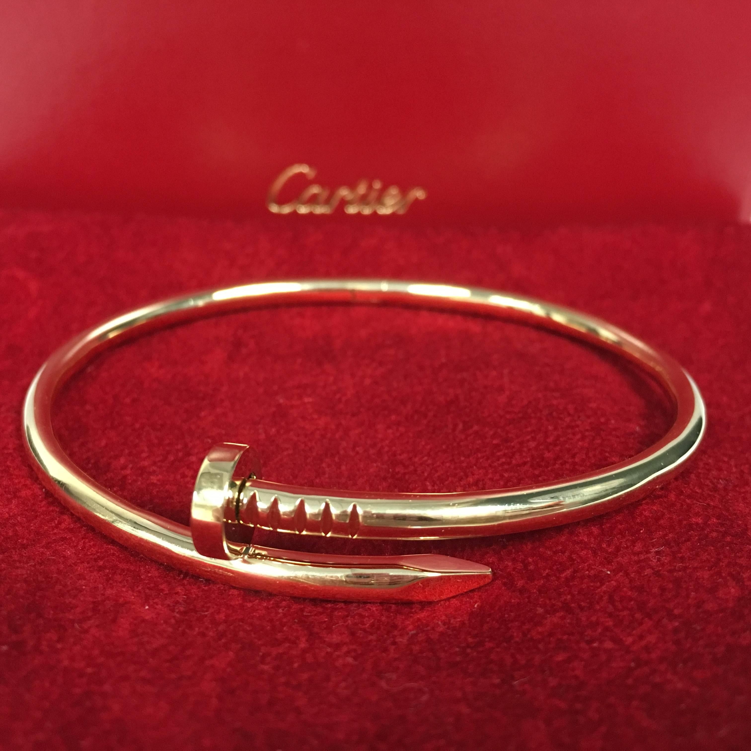 18K yellow gold Cartier nail bracelet. 
Hard to find, size: 21 (Large)
MARKINGS:	Cartier, 750, ©, Cartier Hallmark, (Serial Number), (Size)
Condition: Excellent, like new. Cartier red pouch included. 
An unhindered transformation with a