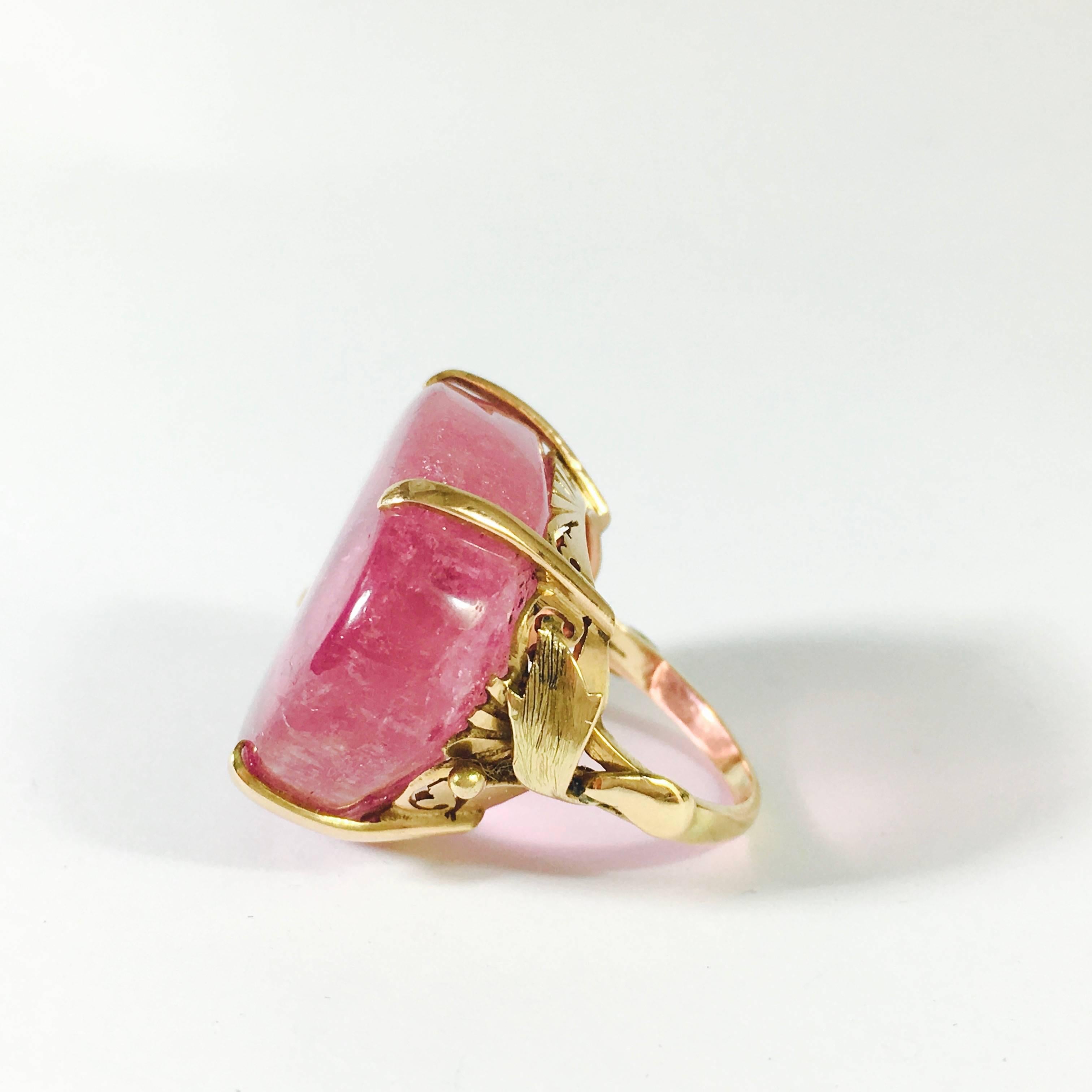 Fantastic Chinese pink tourmaline cabochon solitaire set in a vintage 14K gold setting. The stone measures 26.5 x 22.2 x 7.3 mm, approximate weight of 
35 carats. 
Weight: 14.8 grams 
Size: 4.5 