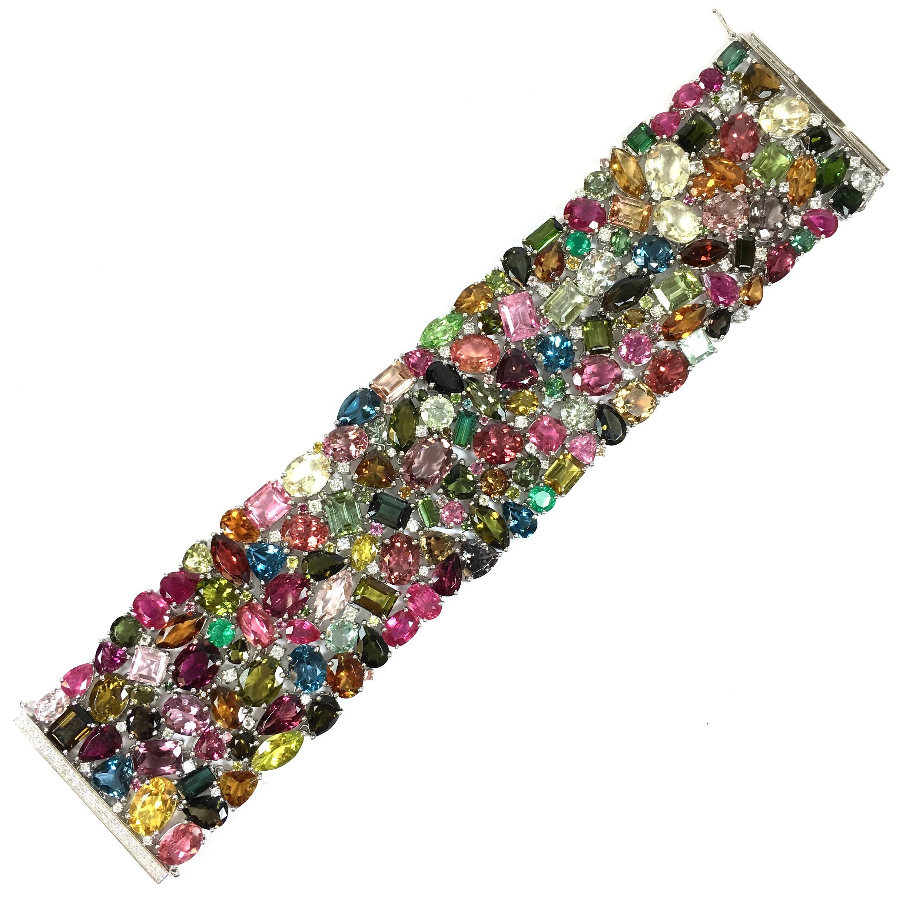 Amazing one of a kind 18K white gold bracelet, composed of 232.50 carats of colored gemstones, (including pink, green, yellow, rubellite and blue tourmaline, aquamarine, peridot, emerald topaz) and 2.10 cts of diamonds.  The bracelet is 1 5/8
