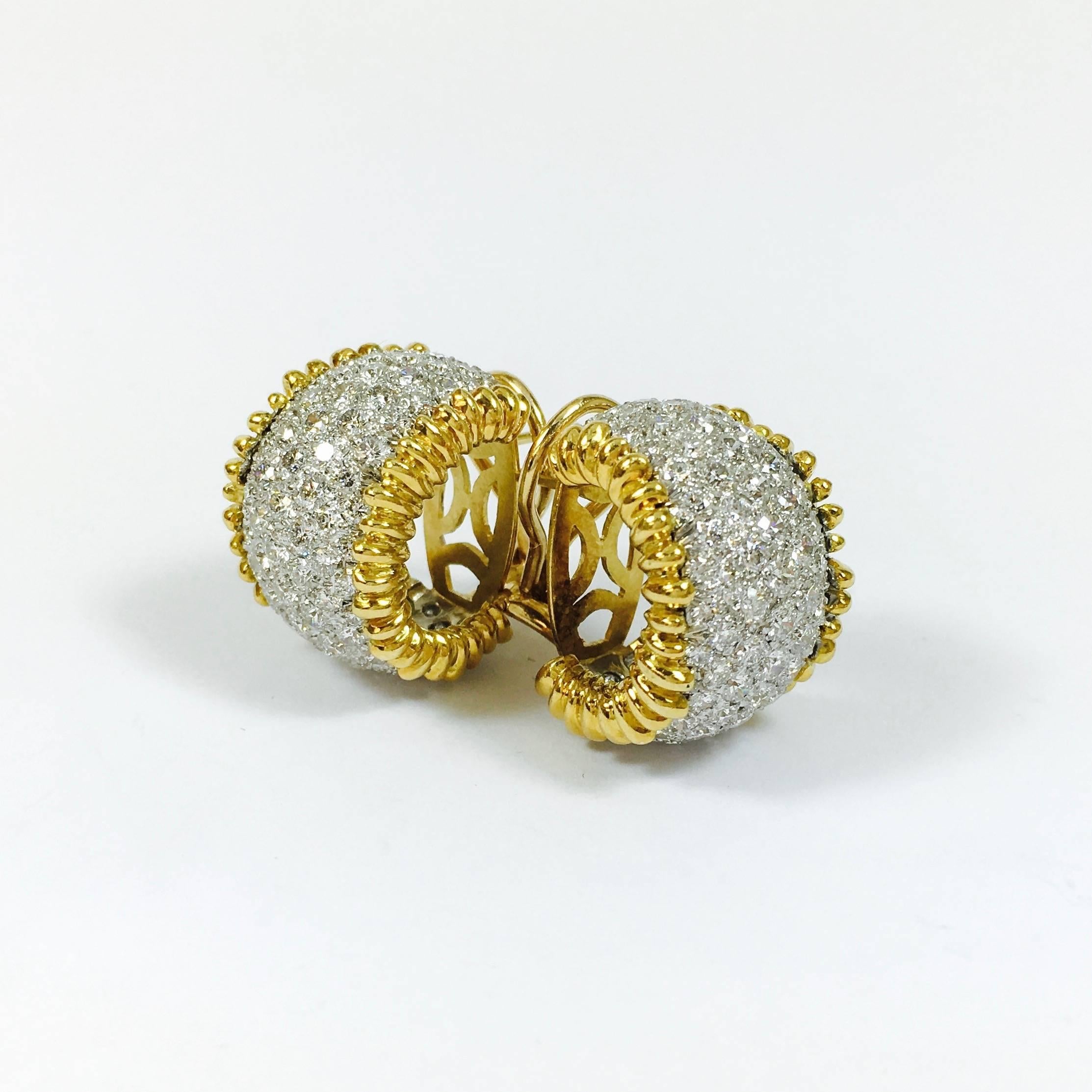 Crafted in 18K white and yellow gold, these amazing vintage diamond hoop earrings  are set with approximately 7.20 carats of round brilliant cut diamonds.
Color: F-G, Clarity: VS1-VS2
Each earring measures: 22 mm Hight x 16 mm Wide 
Weight: 22.7