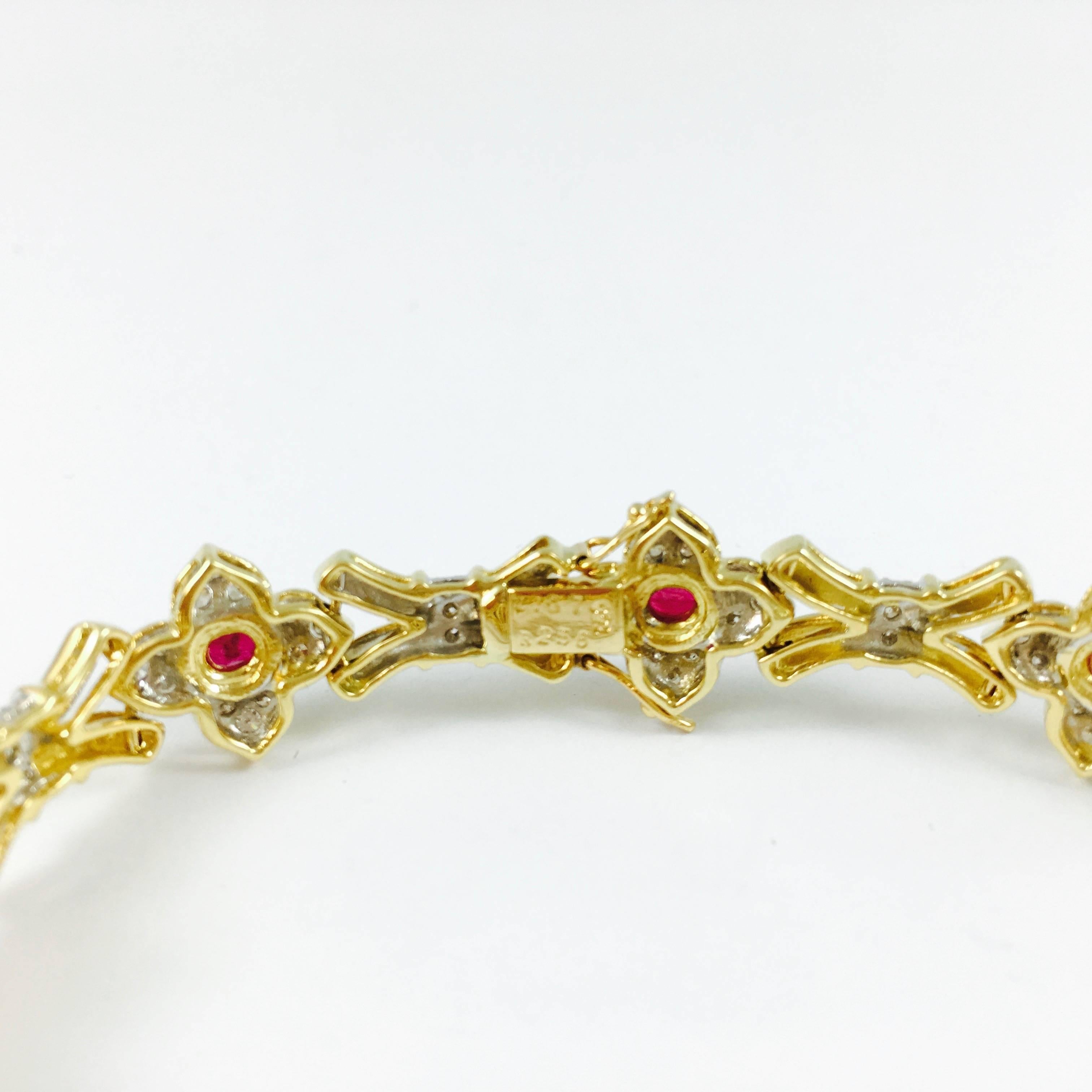 With a timeless design, this bracelet will never go out of style and can passed down to the future generations. Crafted in 18K yellow gold, composed of altenating ruby  and diamond florets and diamond set stylized X links. 
8 oval rubies: 2.56