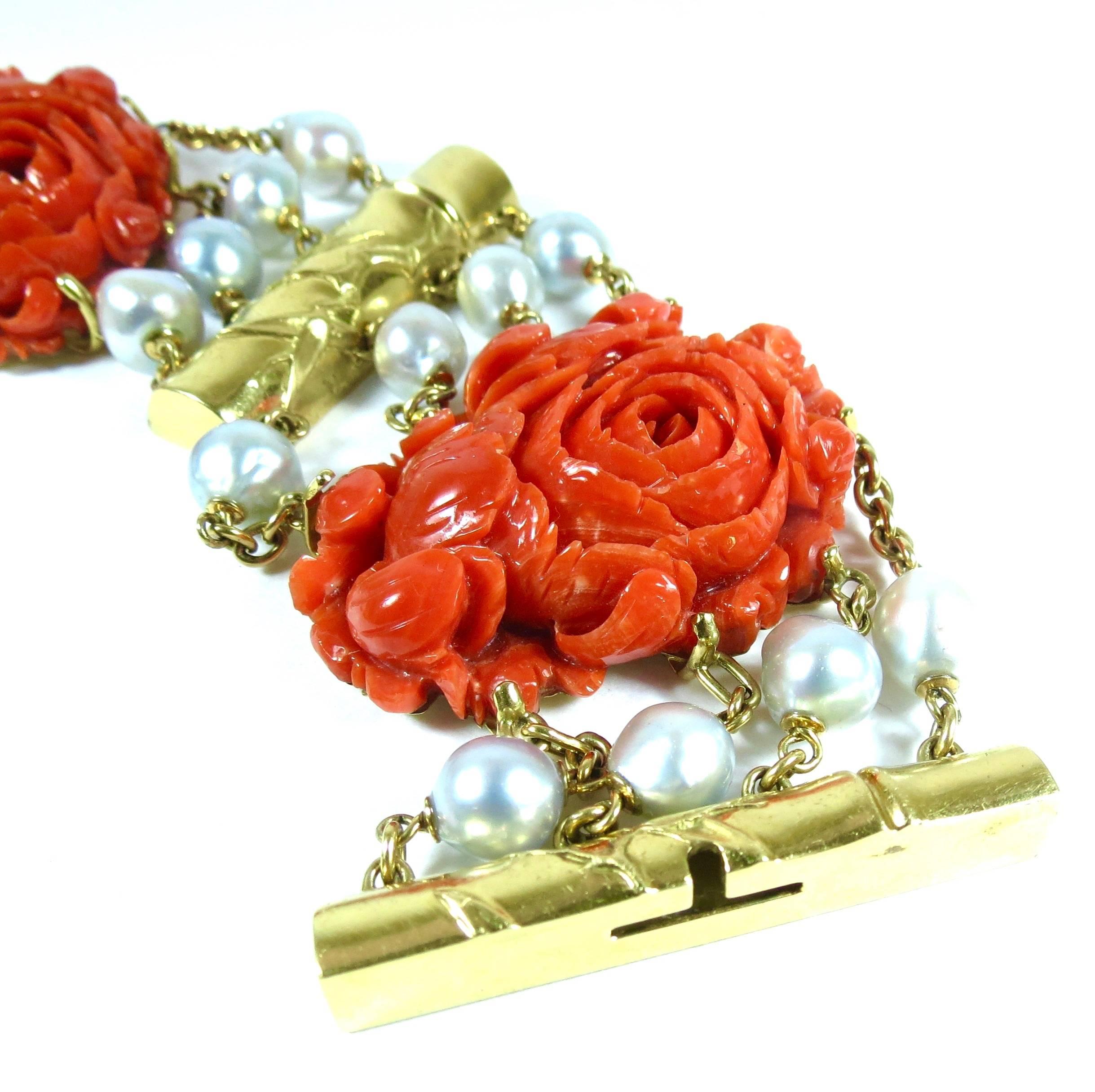 Amazing Seaman Shepps 18K yellow gold, large carved Mediterranean Coral and cultured South Sea Pearl bracelet. 

Measurements: 7