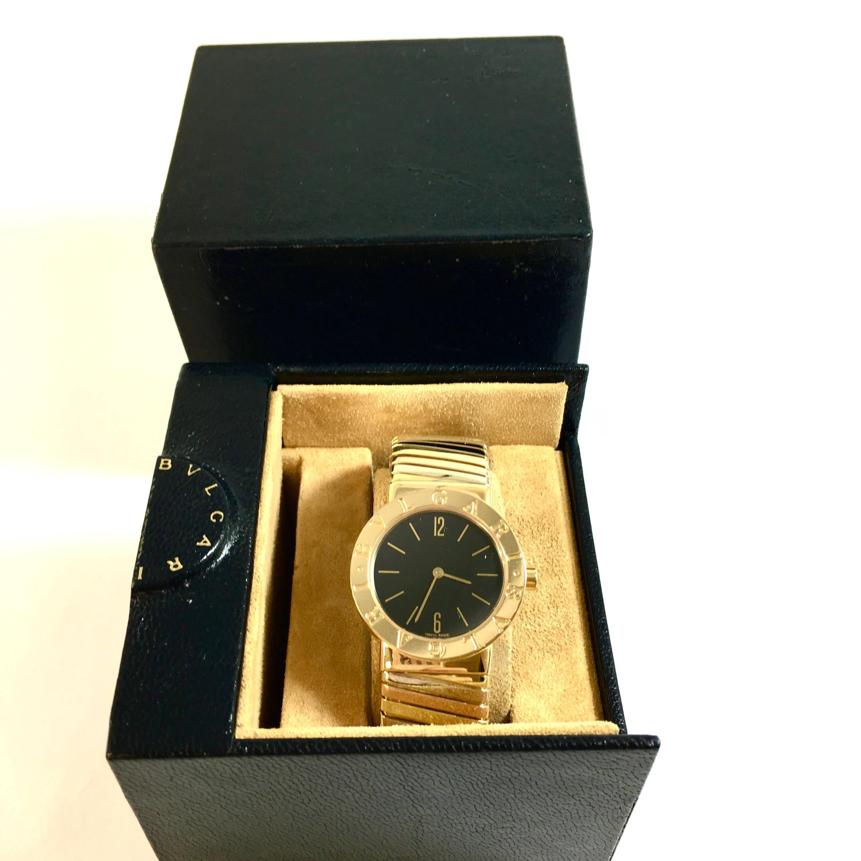 Bvlgari Large 30 mm Tubogas watch Ref# BB 30 2T in 18K yellow, pink & white gold. Condition: Excellent pre-owned. In original box. 
Quartz movement, Sapphire crystal, matt black dial with applied gold Arabic numbers and batons, gold hands. Polished