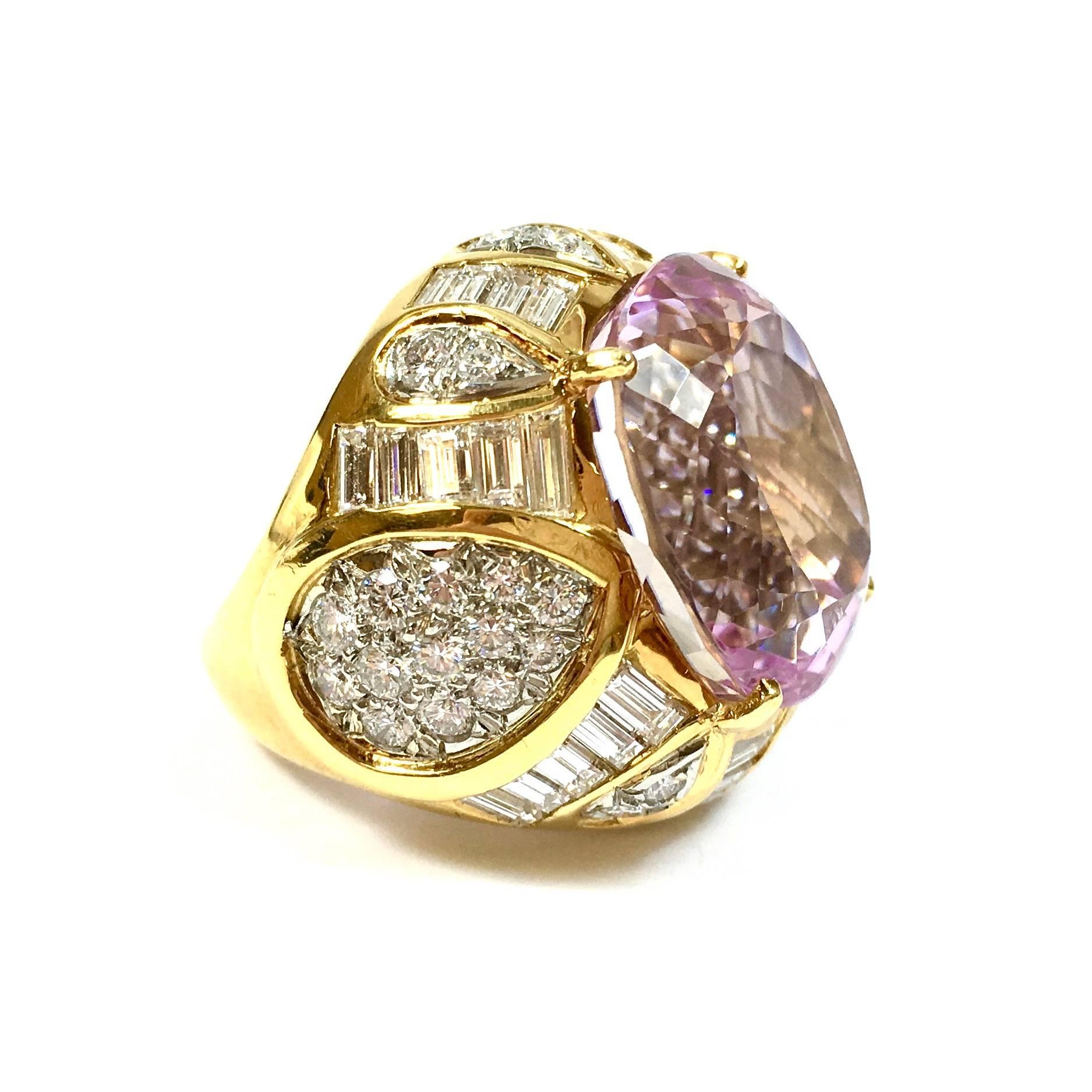 Show stopper ring crafted in 18K gold, featuring an approximately 30ct cushion shaped pastel purplish pink natural kunzite, surrounded by 5.0 carats of diamonds. Color: F-G, Clarity: VS 
The front measures 27 x 25 mm. 
Excellent