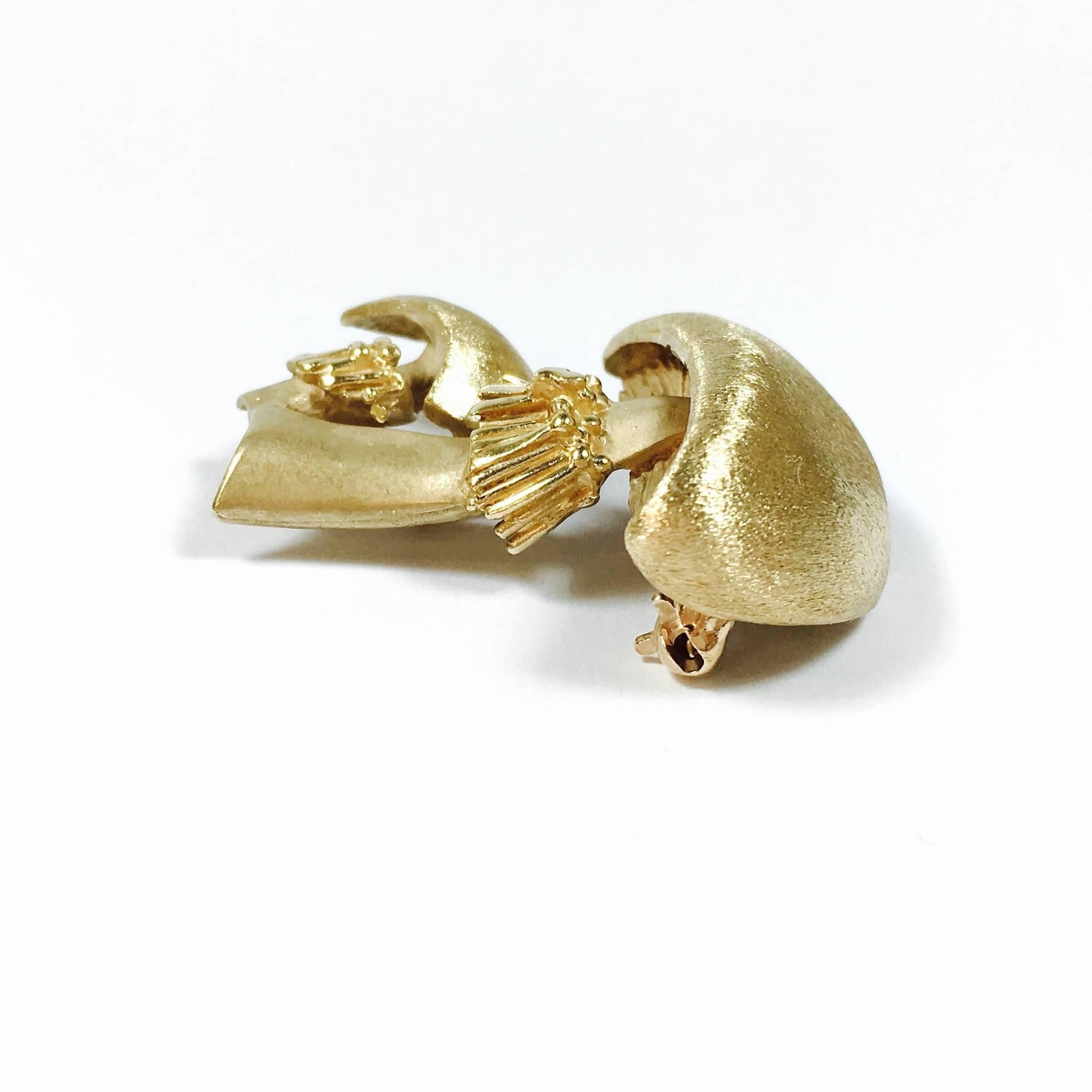14K yellow gold double mushroom pin with a combination of satin, mat and polished finish. Circa 1970's. 
Measurements: 
30 mm H x 25 mm W
Weight: 9.4 grams

