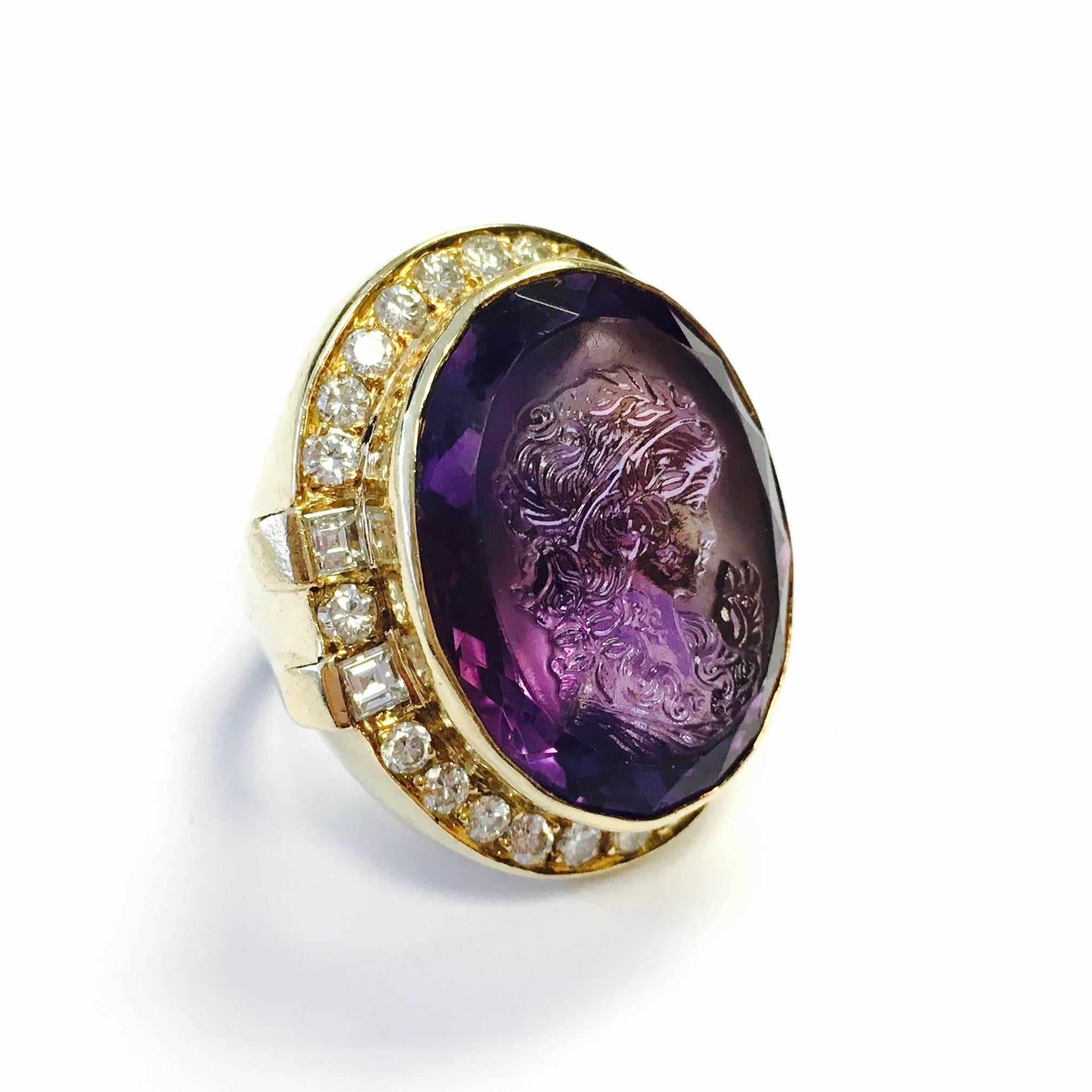 Gorgeous, unusual coctail ring, crafted in 14K yellow gold, featuring an approximately 25ct amethyst cameo, surrounded by a bezel of diamonds, supported by solid gold under gallery and a 4.5 mm wide band.
Diamond weight: 2.00ctw.  Color: G-H,