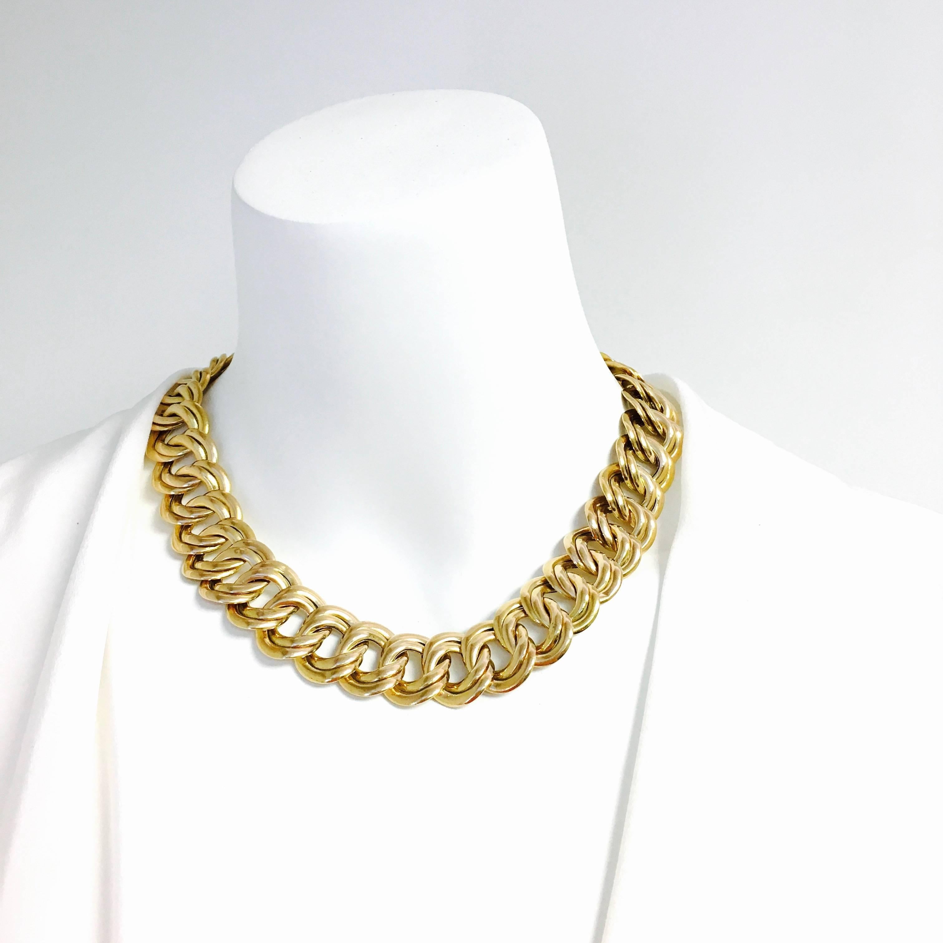 14K yellow gold chain necklace, composed of a series of inter-locking double row links terminating in a hidden clasp with safety. 
Measurements: 
Length: 18 1/4