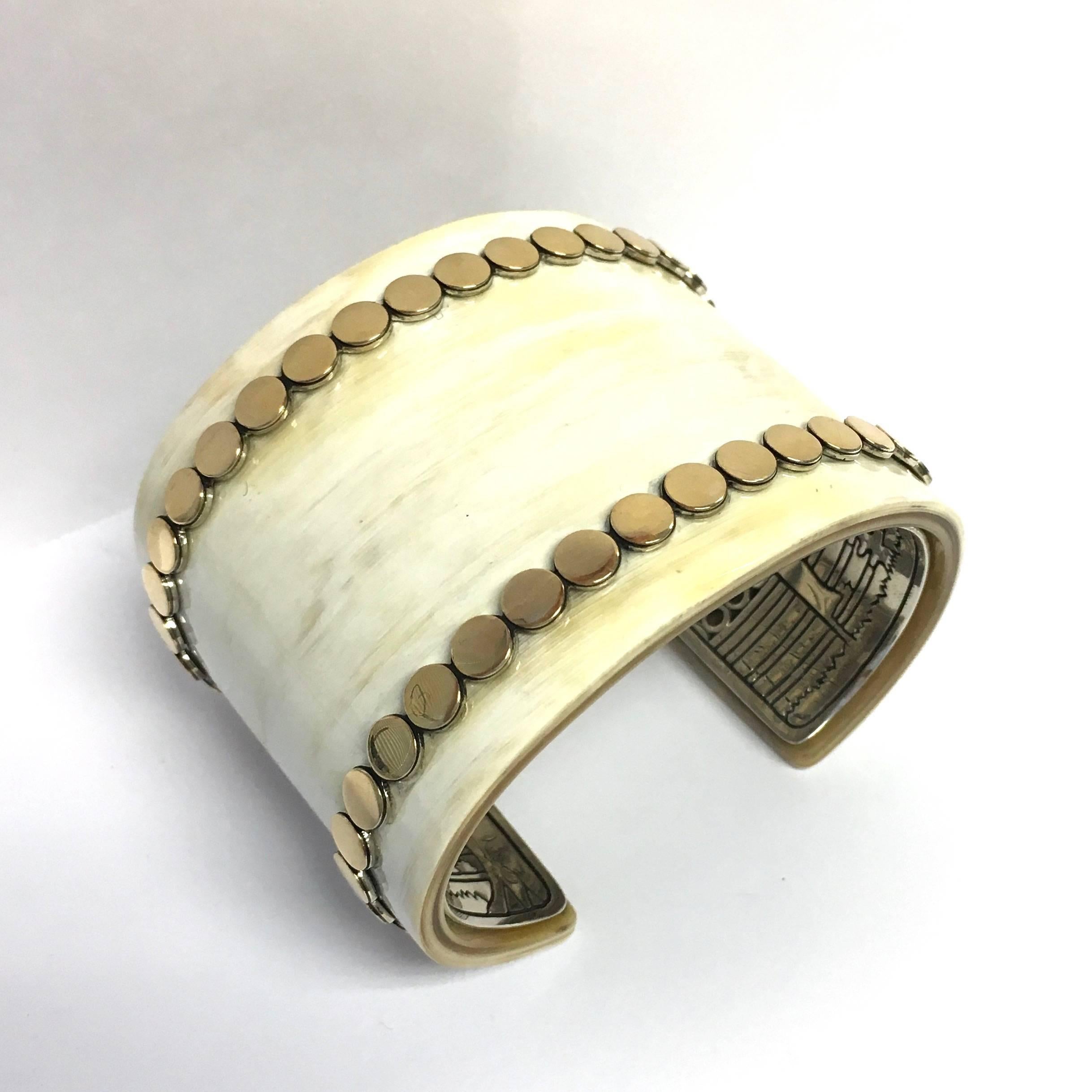 John Hardy Dot Buffalo Horn 18K Yellow Gold & Sterling Silver wide cuff b racelet. From the Dot Collection. Dots of 18k yellow gold trace the borders of a smooth, wide cuff of buffalo horn to impart their radiant gleam, the design set upon a