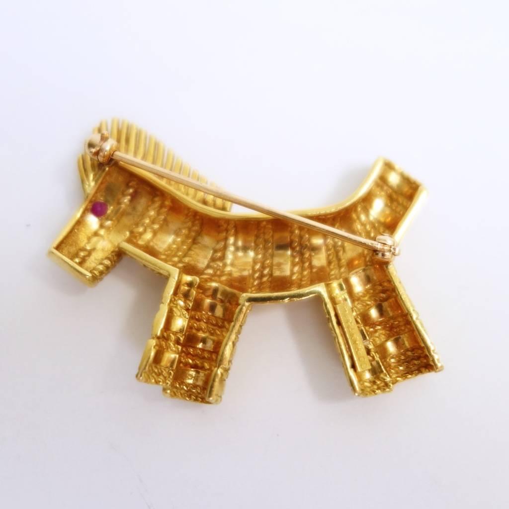 Rare Tiffany & Co. textured 18k yellow gold toy zebra brooch with ruby eye.
Sweet addition to every collection. 
Marked: TIFFANY&CO
Serial# 13117
Measurements: 
42 mm W x 31 mm H x 8 mm D
Weight: 14.1 grams