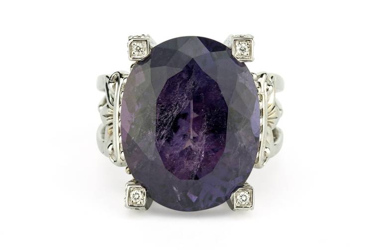 20.19 carat natural purple Tourmaline set with 18K White Gold and 0.52 carats of F/G VS Diamonds.