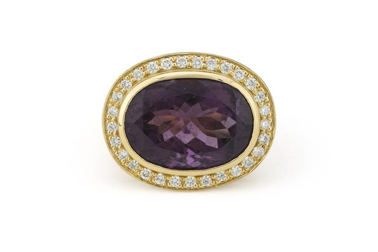 16.30 carat natural purple Tourmaline (very rare specimen of natural, vivid purple color) set with 1.28 carats of F/G VS Diamonds and 20.9 grams of 18K Yellow Gold.

Ring Size: 6.5.