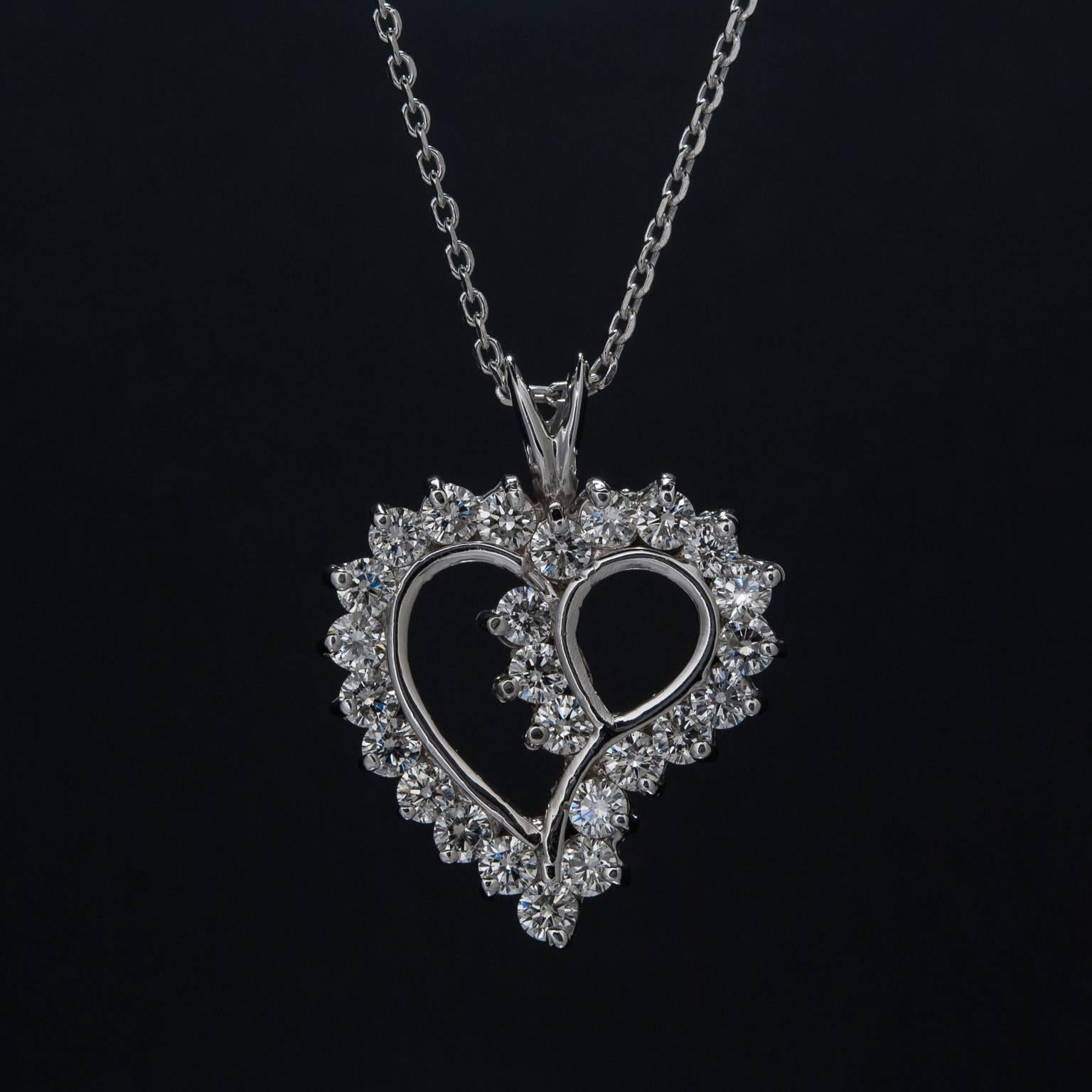 This beautiful heart-shaped pendant includes 24 brilliant diamonds weighing a total of 1.92 carats. This piece is crafted in 14k white gold.