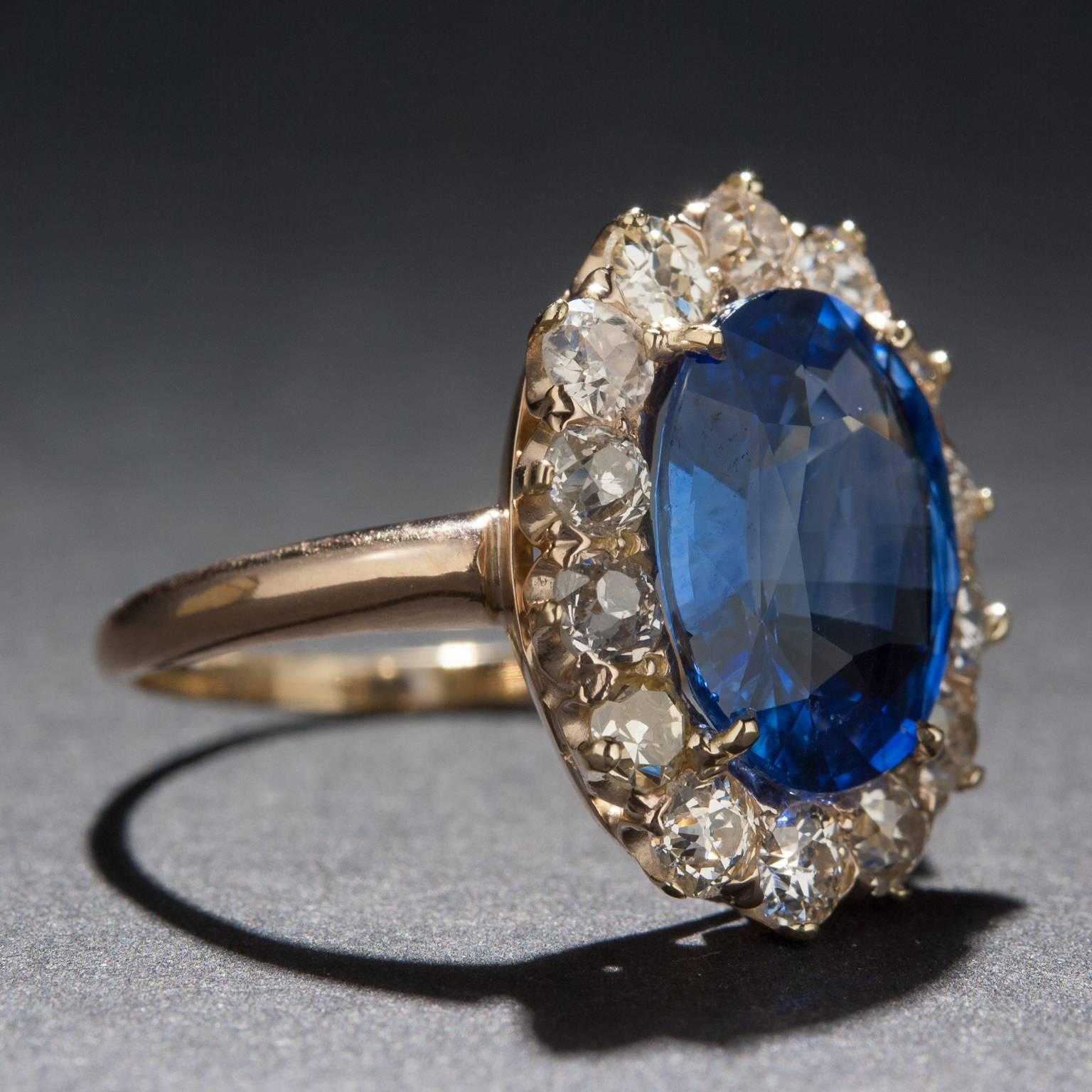 An absolutely beautiful 4.71ct oval cut sapphire dazzles at the center of this estate ring. The center sapphire is accented by a total of 1.68 total carats of sparkling diamonds and the ring itself is crafted in 14k yellow gold. This stunning piece