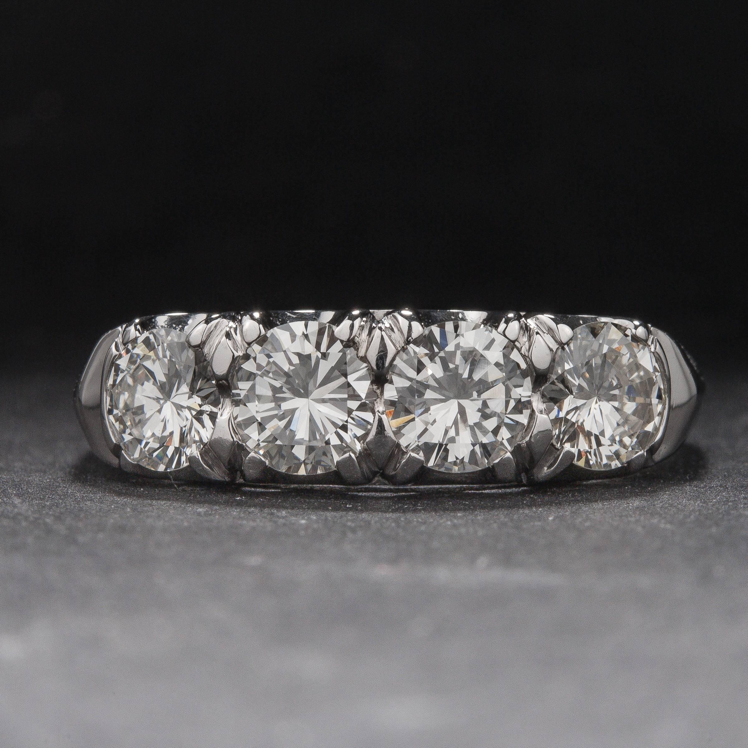This bold 4-stone ring features 4 diamonds weighing a total of 1.20 carats. The mounting is crafted in 14k white gold and is currently size 8. This ring may be sized to fit.