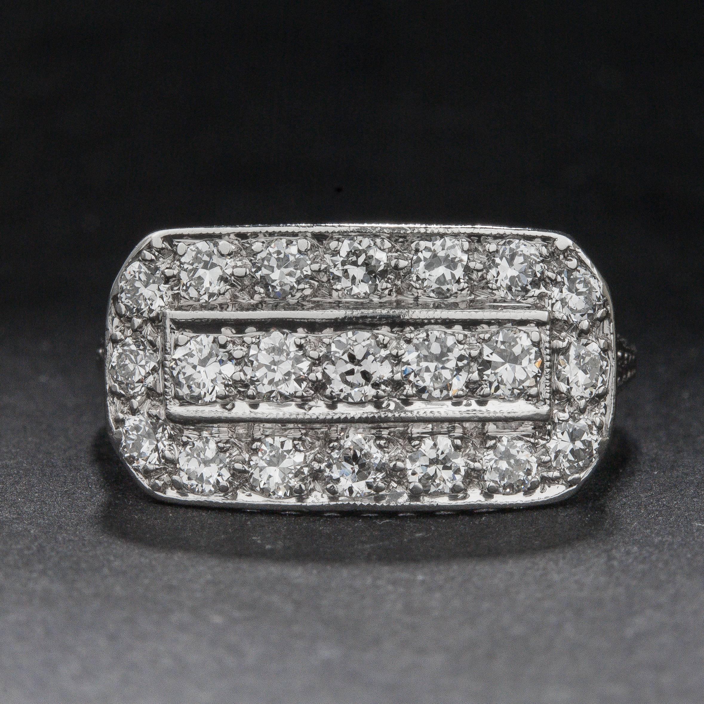 A striking Art Deco style right-hand ring with .60 total carats of diamonds. The ring is crafted in platinum and features beautiful engraving along the shank.

This ring is currently size 6.75 and can be sized to fit.