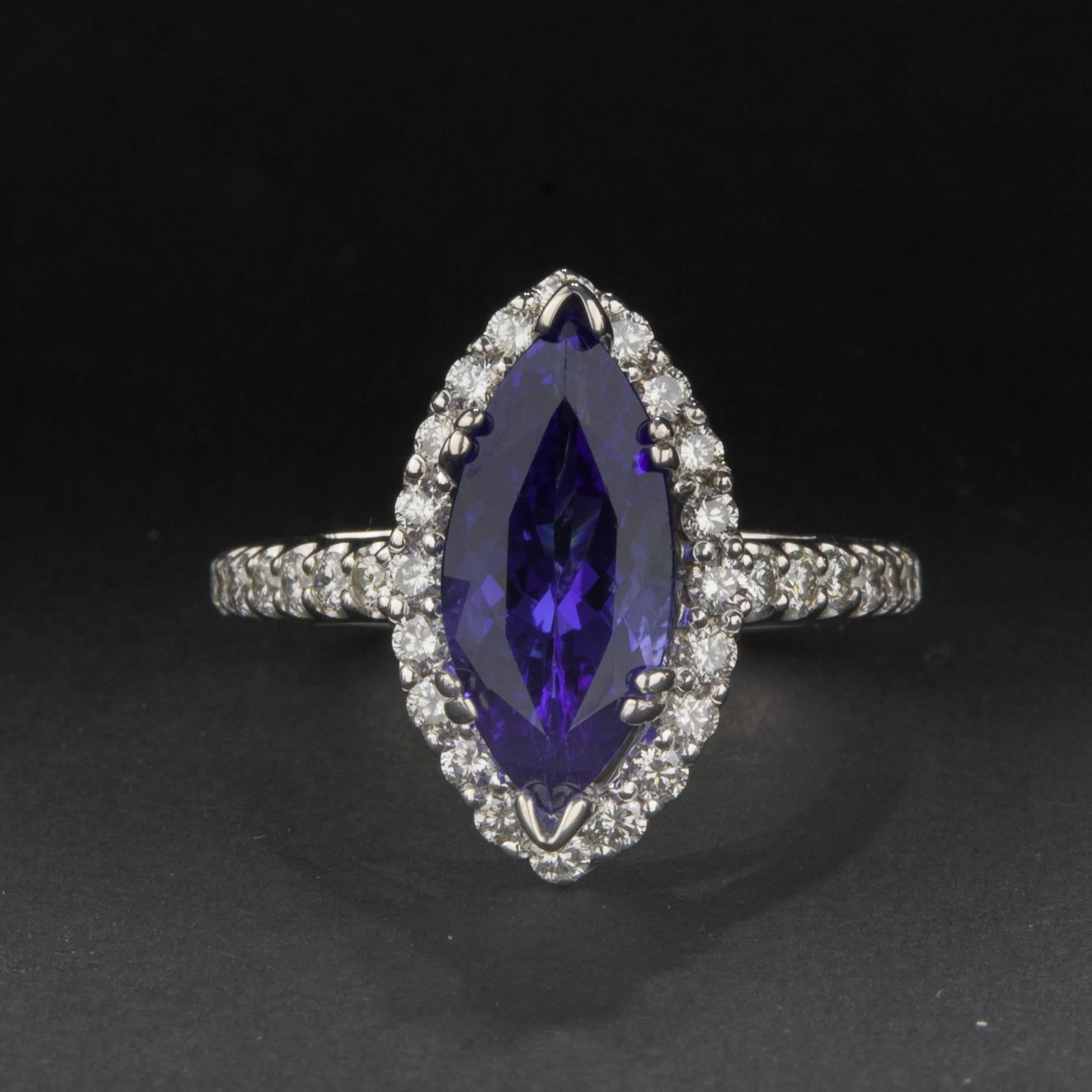 A beautiful 2.83 carat marquise cut tanzanite ring with diamond accents. The setting is crafted in 14k white gold and features approximately 1.00 total carats of diamonds. This ring is currently size 6.75.