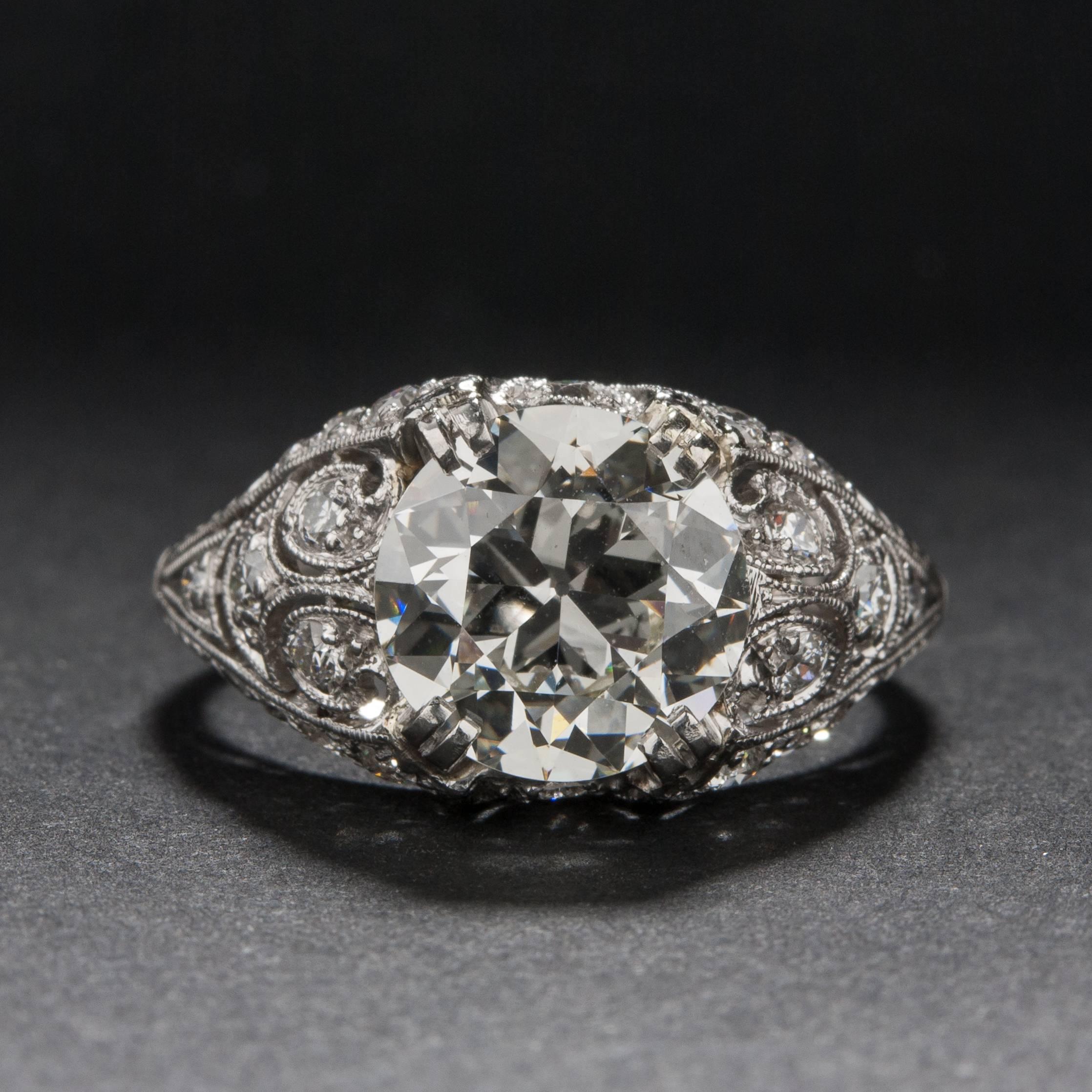 A stunning Edwardian era ring, hand crafted circa 1910. This beautiful piece features a 2.42 carat center diamond (Estimated I color, VS1 clarity) and .40 total carats of side diamonds. The mounting is crafted in platinum and the ring is currently