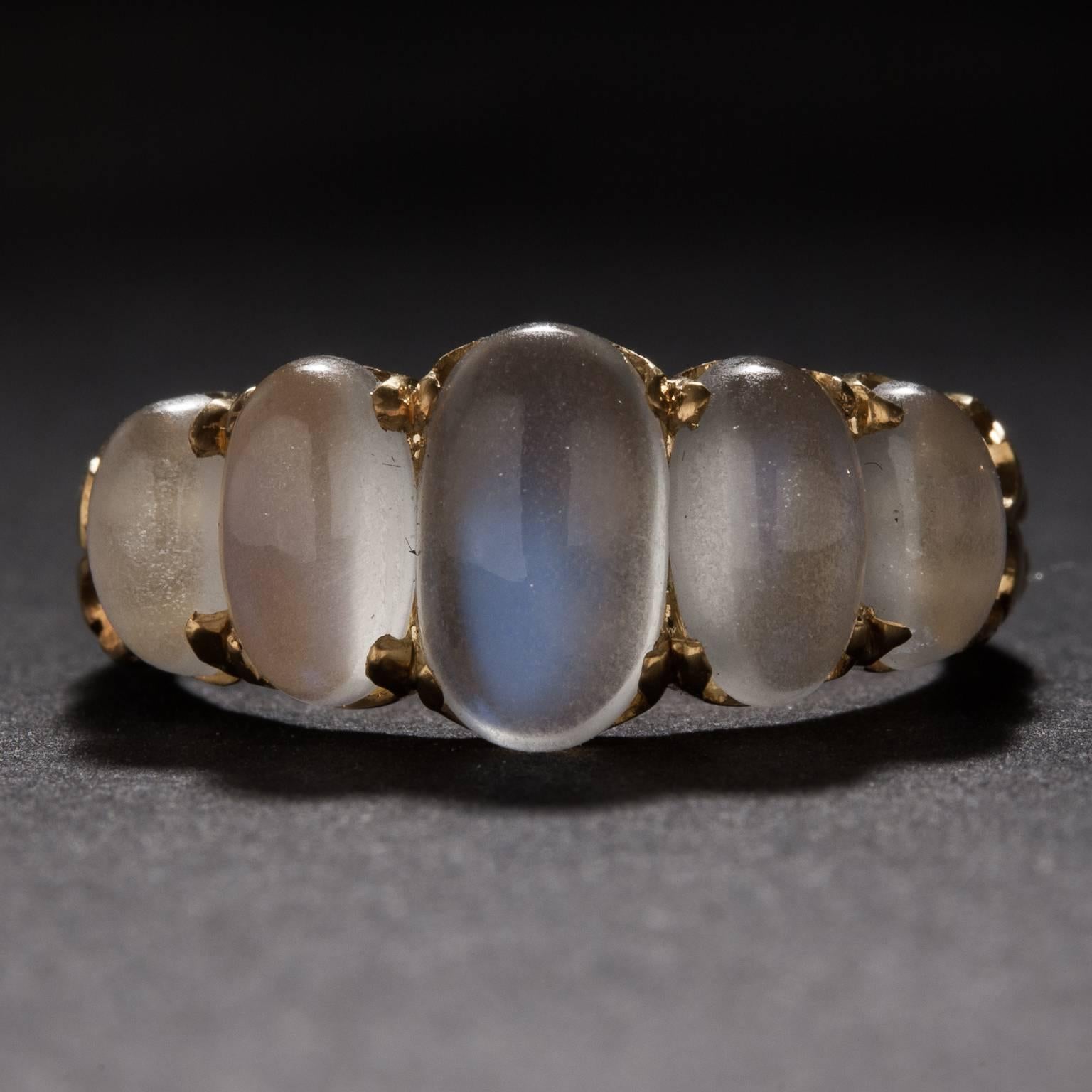 This lovely ring features 5 moonstones for a total of 3.79 carats. It is crafted in 15k yellow gold and it is currently size 6.5.