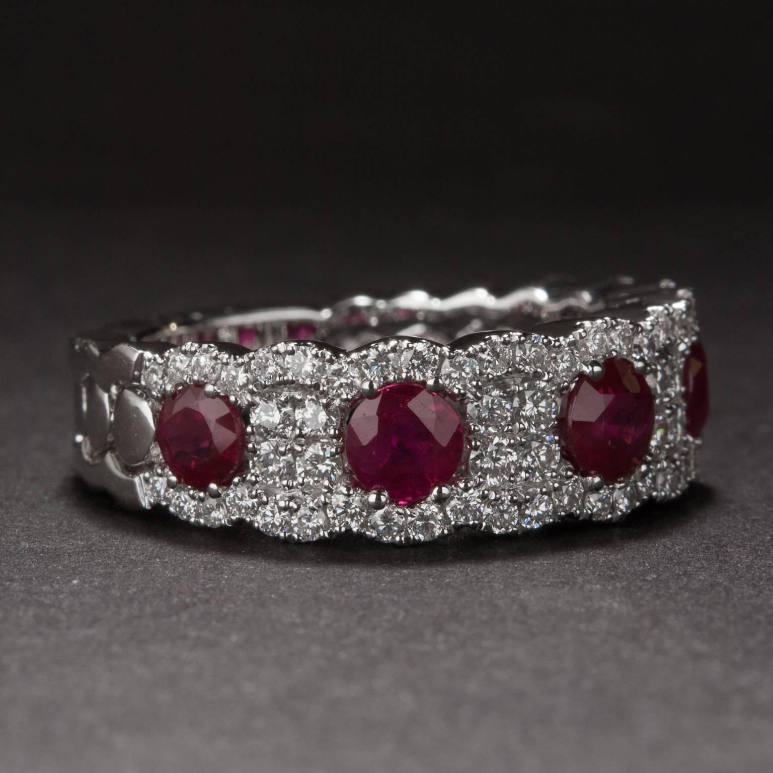 A lovely 7mm wide half-eternity band with .72 total carats of ruby and 1.56 total carats of diamond. The mounting is crafted in 14k white gold and is currently sized at 6.5.