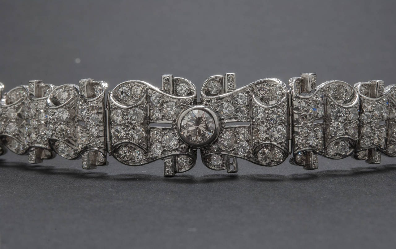 An absolutely stunning Retro diamond bracelet. The piece features a 1.30 carat center diamond (VS1 clarity, Faint Brown color) and 14.00 total carats of single cut, transition cut and full cut diamonds (H-K color, VS-SI clarity). The bracelet is