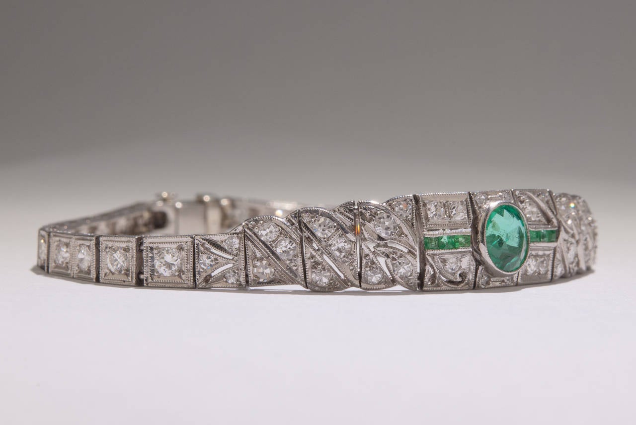 This exceedingly elegant Art Deco platinum bracelet features approximately 1.00 total carats of Emerald and 3.50 carats of Diamond. The bracelet measures 6 inches in length.
