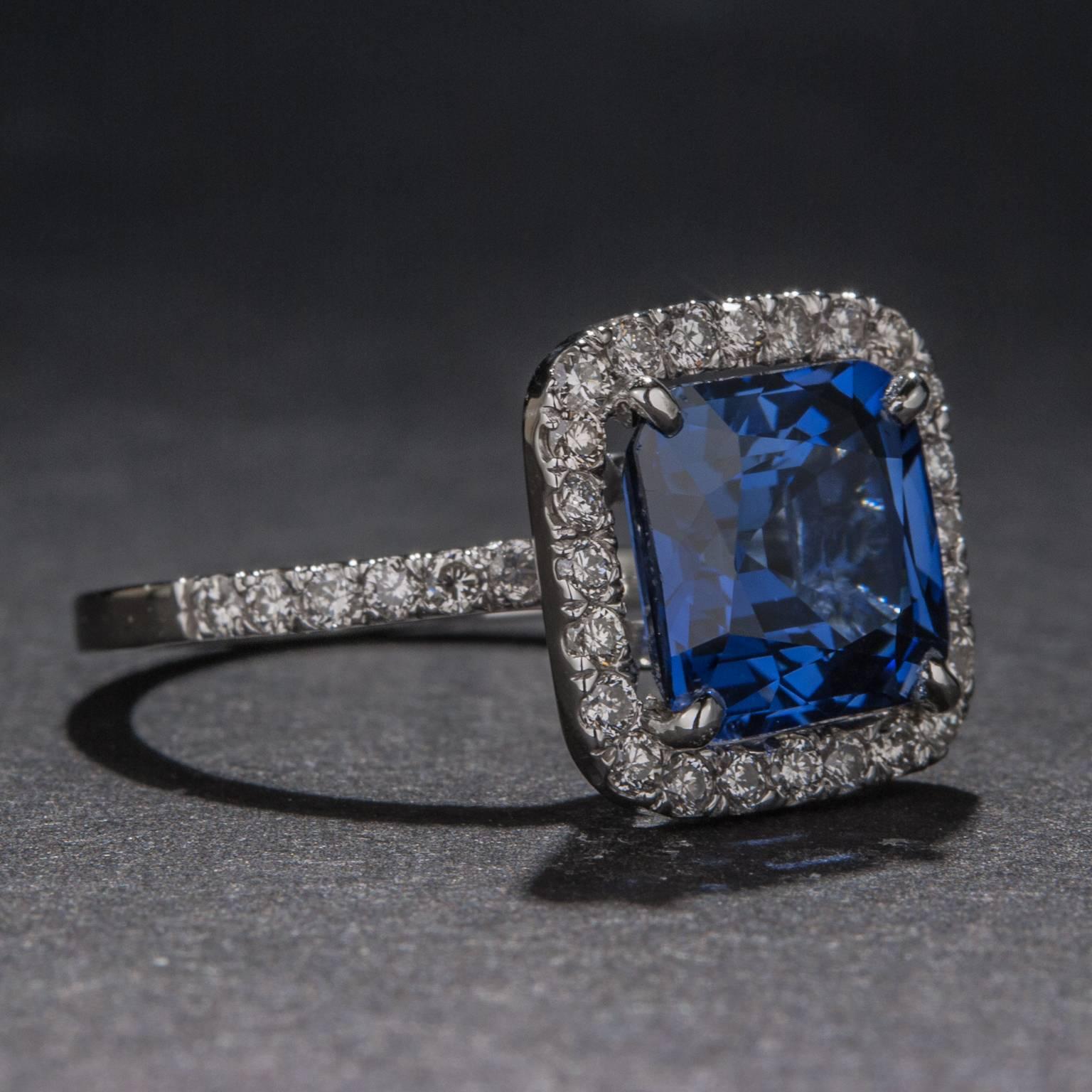 An absolutely stunning 14k white gold ring featuring a 4.28 carat center sapphire surrounded by .65 total carats of diamonds. This ring is currently size 6.5 but it may be sized to fit.
