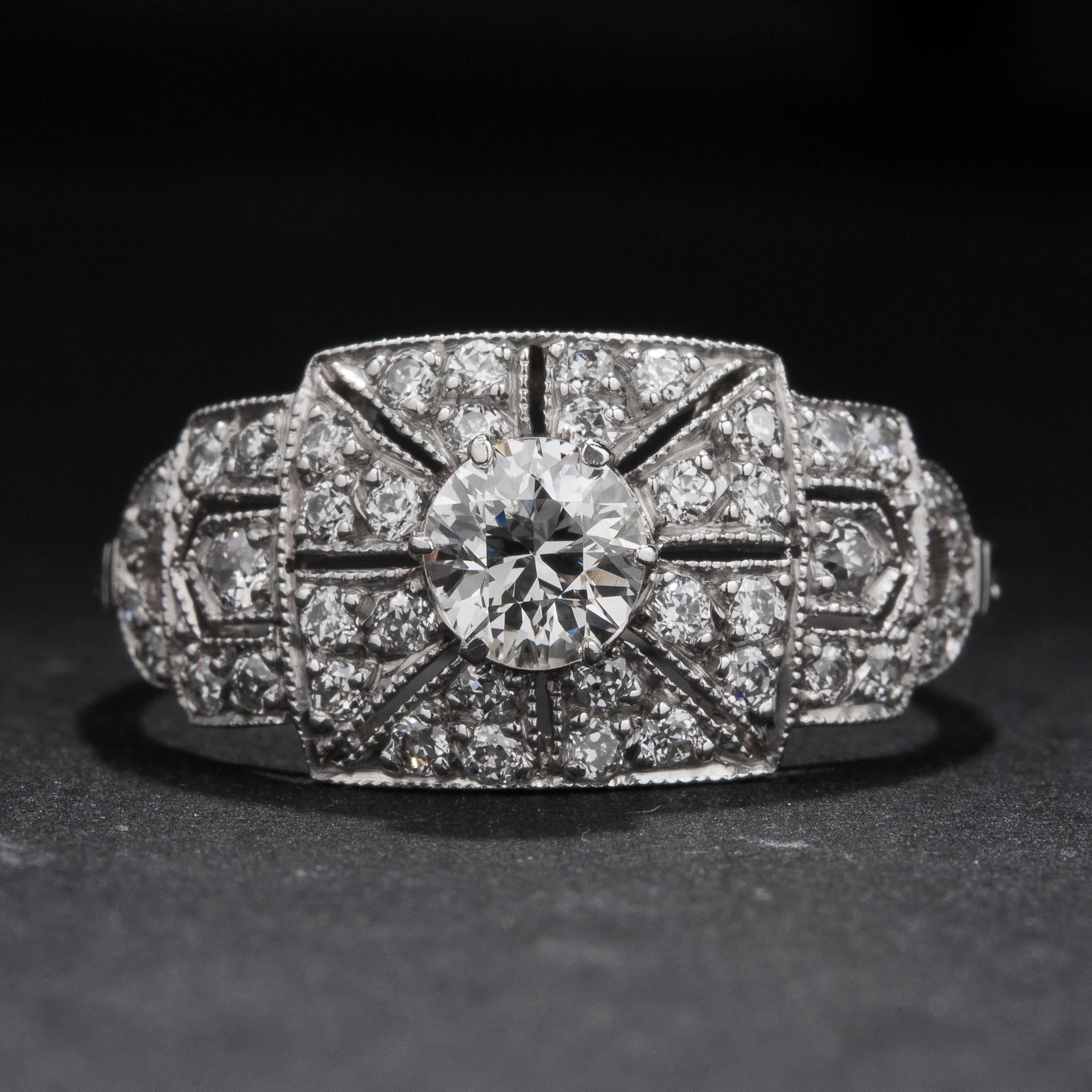 A lovely Art Deco style ring with a .36 carat center diamond and .40 total carats of accent diamonds. This piece is made in platinum and is currently size 7.