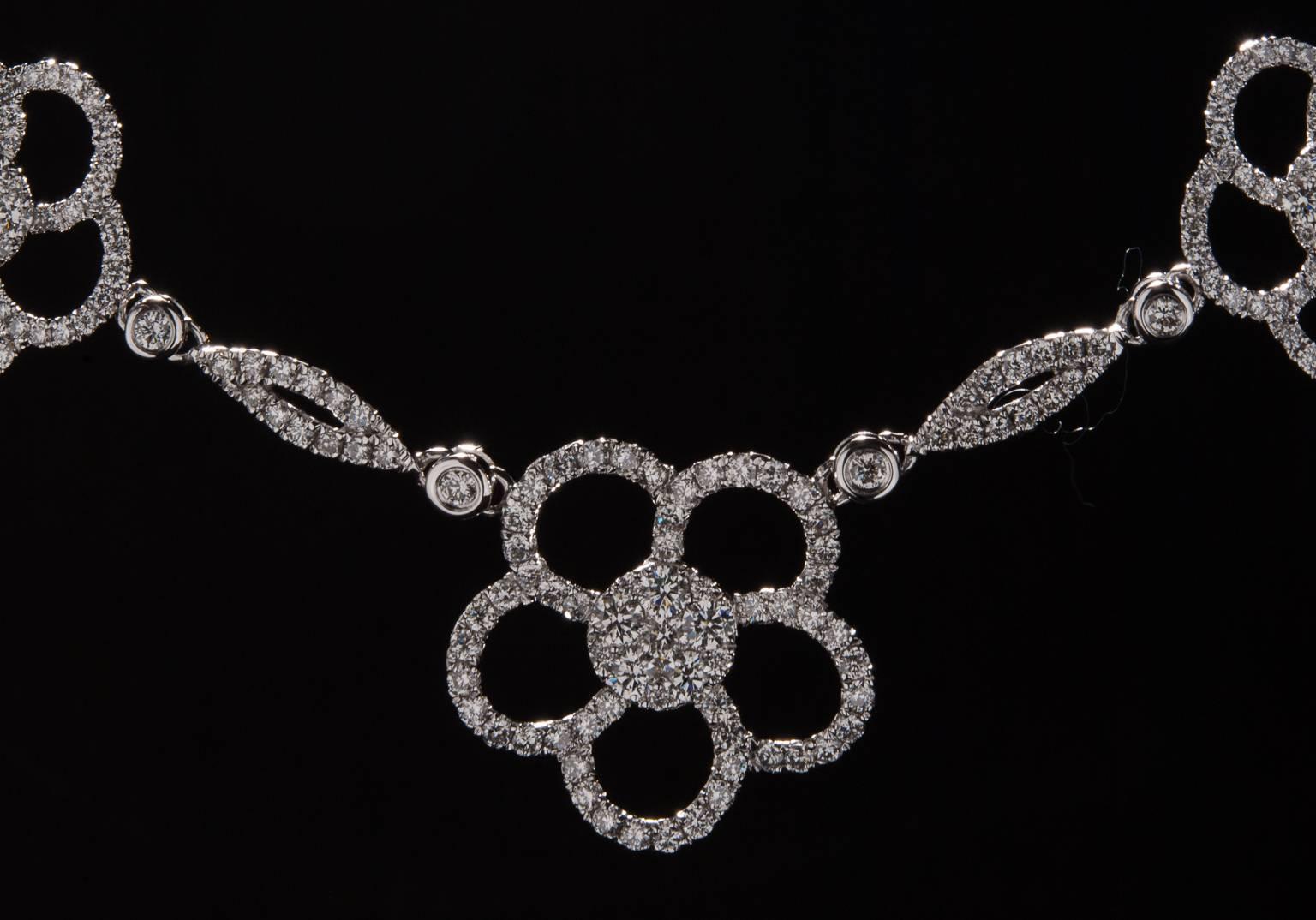 A stunning floral diamond necklace made in 14k white gold. This lovely piece measures 17 inches in length and features 3.51 total carats of diamond. 