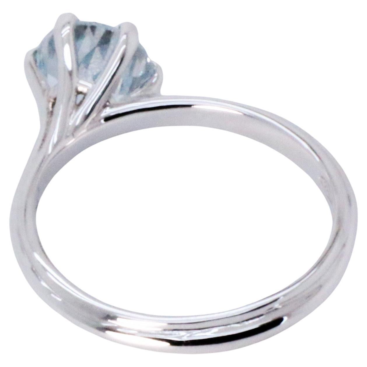 18K White Gold Asymmetric Cosmic Design Stackable Aquamarine Cocktail Ring.
The stackable Egle ring is made of 18 karat white gold and features a round mixed cut natural aquamarine around 1.45 carats, diameter 6.7 mm. The total weight of the ring is