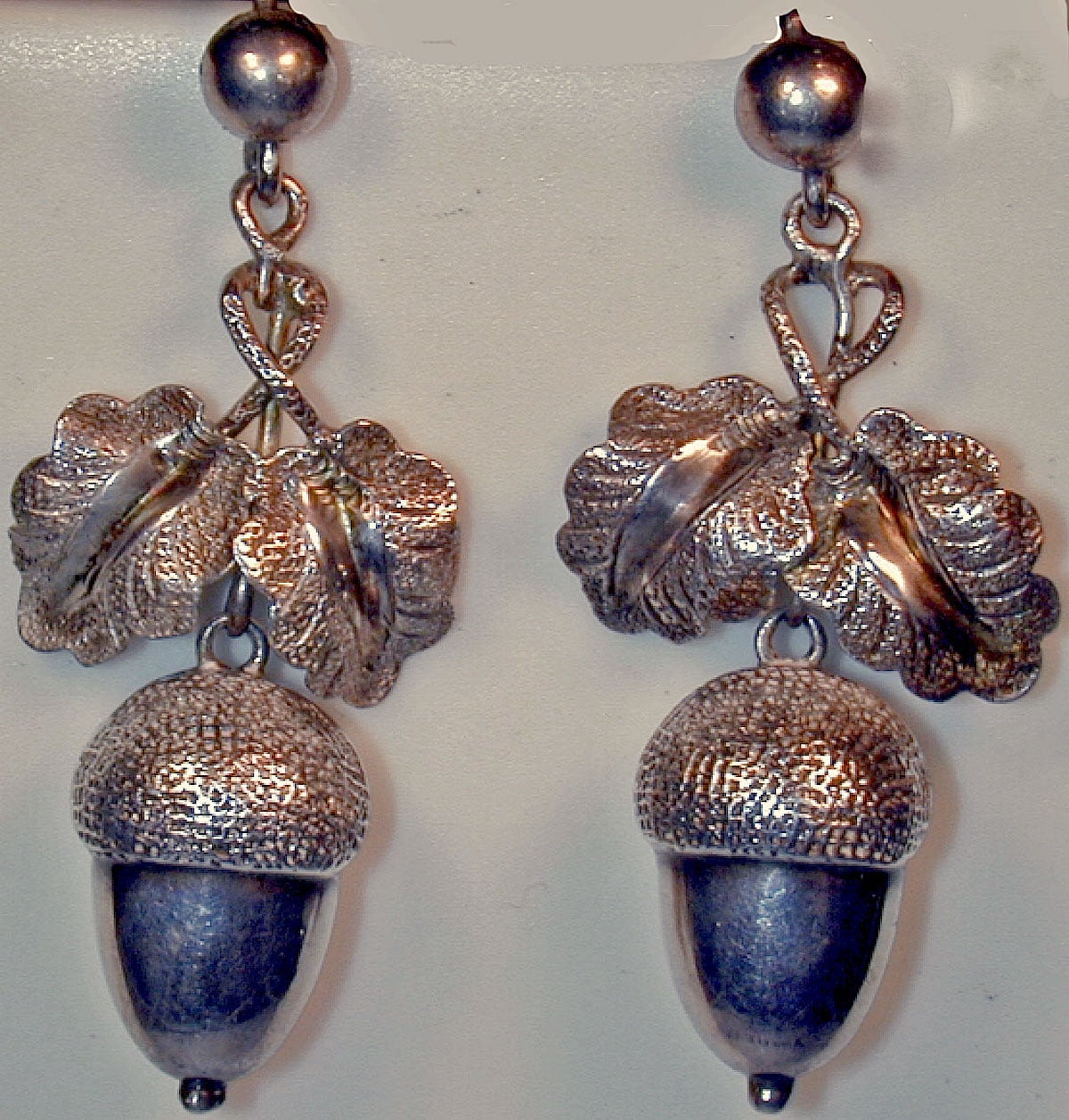 Antique silver acorn earrings are wonderful and easy to wear. The acorn is a symbol of hope and was often used in heraldry. These earrings measure 1 5/8