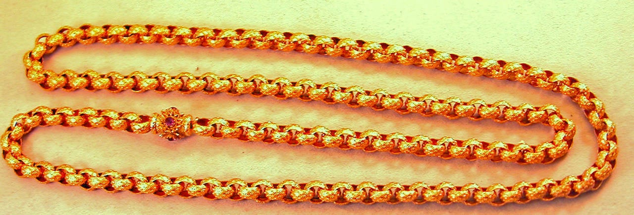 Georgian pinchbeck muff chain with a barrel clasp set with 