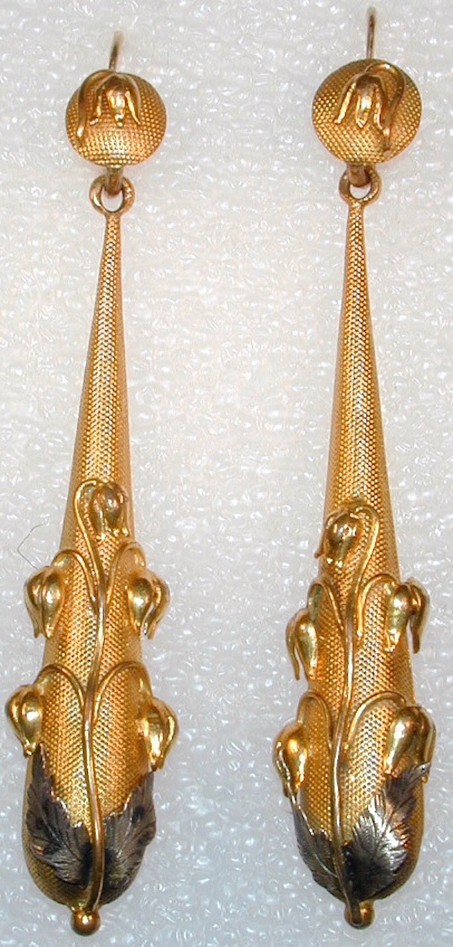 Elegant Georgian pinchbeck long drop earrings in a floral design enhanced by silver leaves. Pinchbeck is an alloy developed by Christopher Pinchbeck in 1720 to simulate gold. His alloy of copper and zinc looks like gold and does not tarnish. The