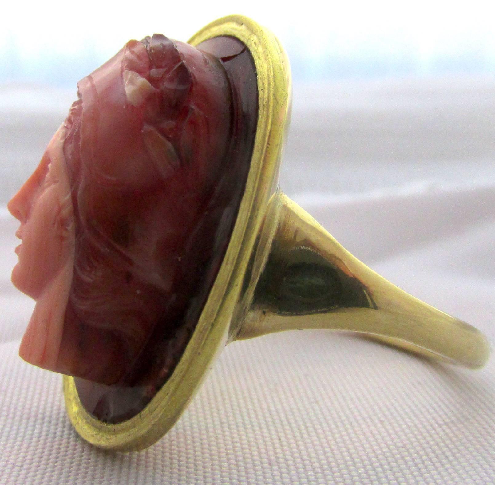 18th century,  15K gold ring set with a banded agate cameo of the goddess Athena. This deeply carved Italian cameo dates to c. 1780, possibly carved by Morelli Amastini Bernini.   It is not inlaid but is brilliantly carved from a single stone. The