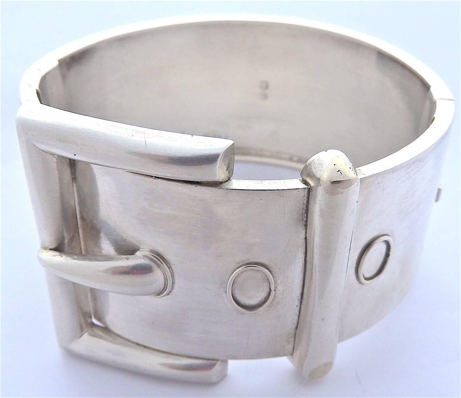 Striking silver Victorian bangle with a bold buckle motif.  Sure to cause admiring glances when worn day or night.  The bracelet measures 1 5/8