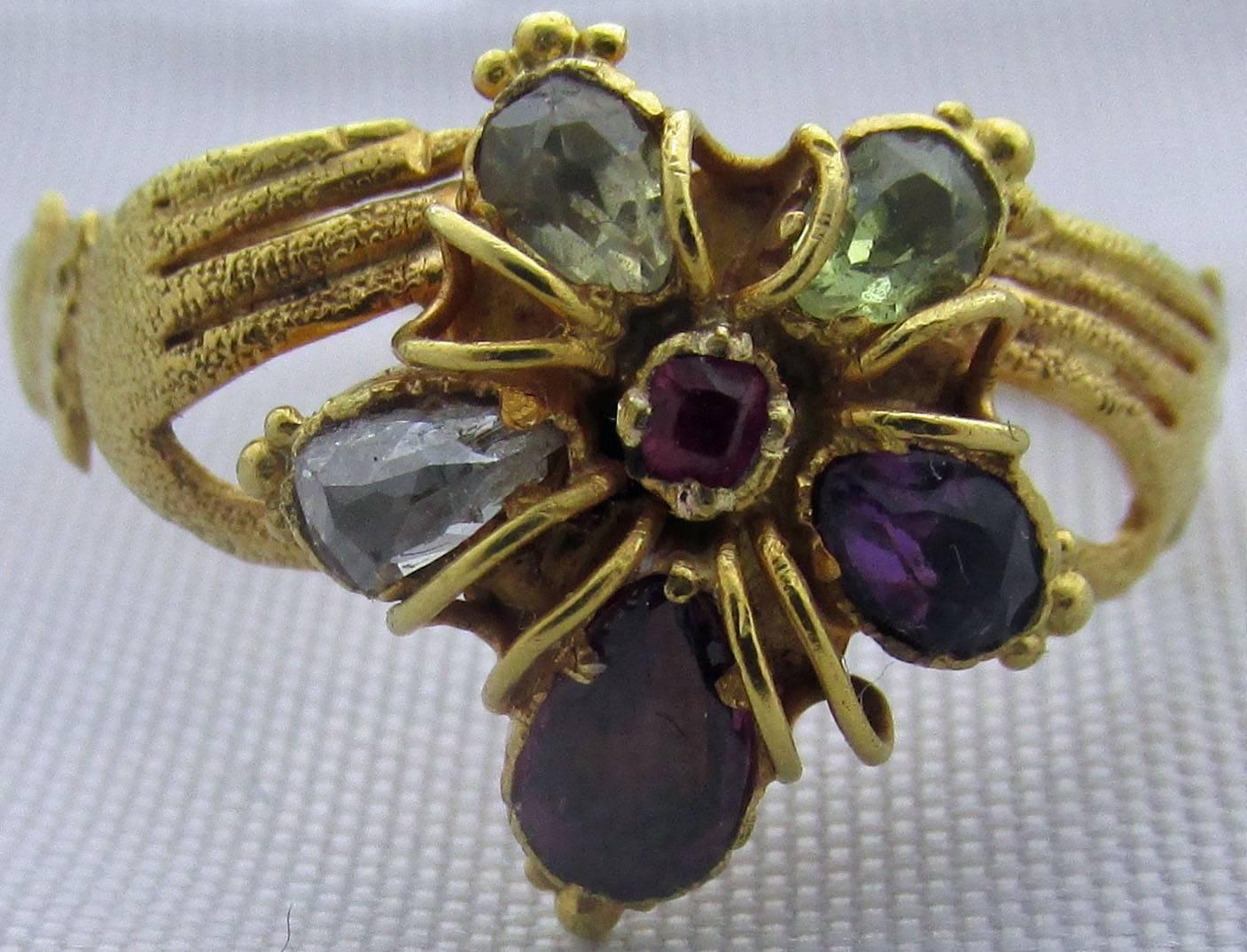 Fabulous Georgian 18K gold and multi-stone pansy ring, the flower supported by a pair of hands, a classic Georgian motif of hands offering a gift. The pansy is a symbol for 